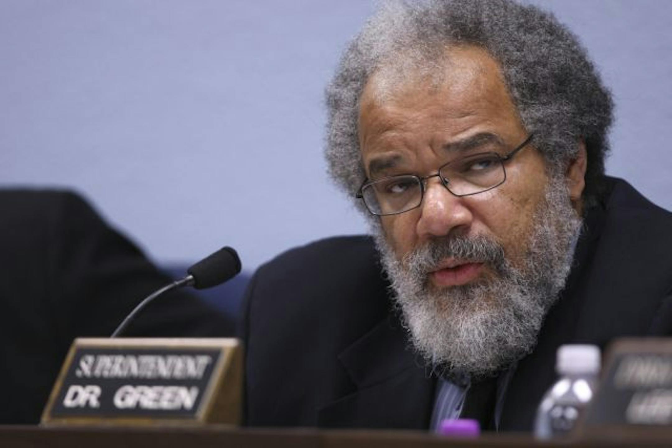 Minneapolis School Superintendent Bill Green read a resolution at the start of the school board meeting.