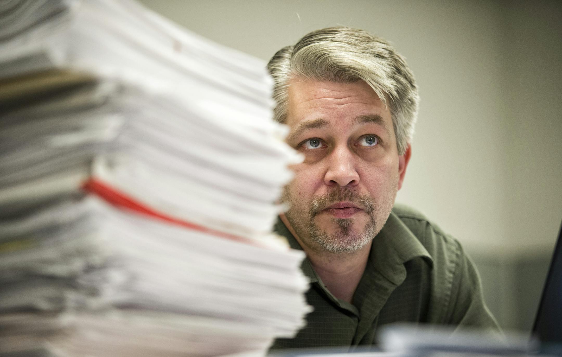Dan McGrath, director of Minnesota Majority, with a stack of documents he says are 1099 instances where convicted felons were wrongly allowed to vote in the 2008 election. He has been examining data to find examples of voter fraud in Minnesota. Monday, October 22, 2012 ] GLEN STUBBE * gstubbe@startribune.com