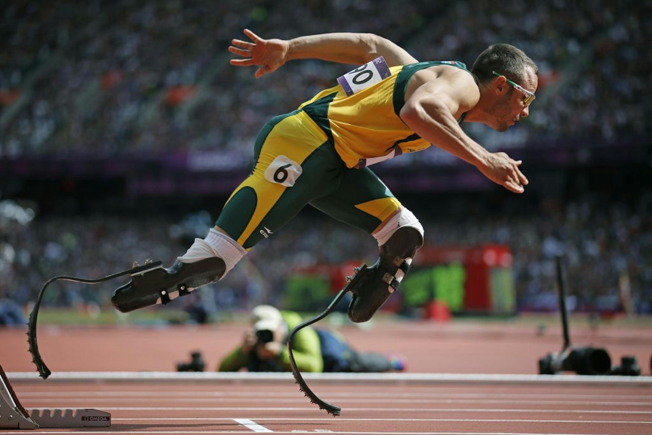 Oscar Pistorius, a double leg amputee Olympic runner from South Africa, warms up at the Olympic stadium, August 3, 2012, in London.