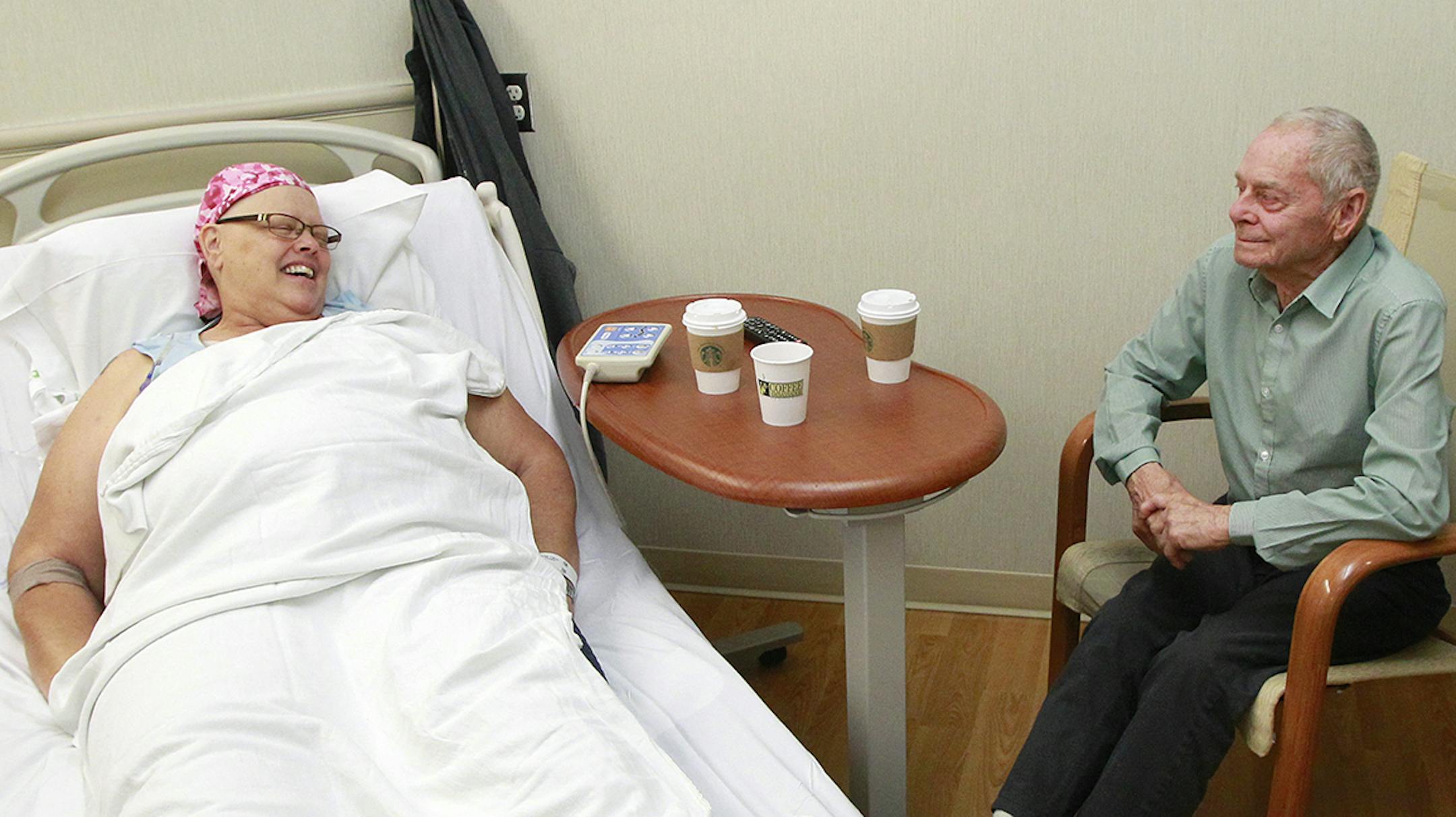 Elaine Deboe receives chemotherapy for a rare form of breast cancer, accompanied by her father, Roy Phillips, at Scripps Clinic Anderson Outpatient Pavilion in San Diego. (Eduardo Contreras/San Diego Union-Tribune/TNS)
