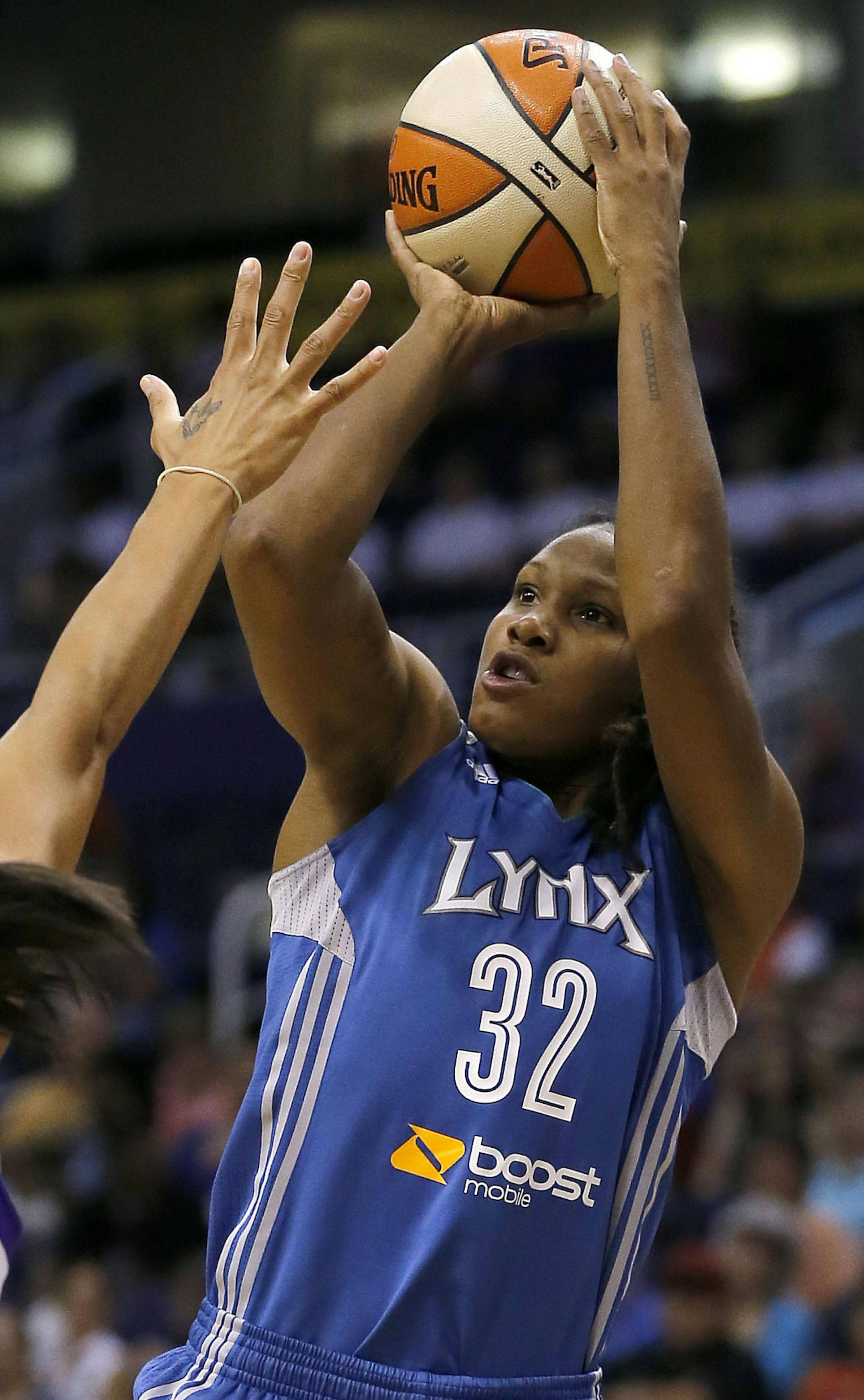 Minnesota Lynx forward Rebekkah Brunson (32) shoots over Phoenix Mercury forward Candice Dupree (4) during the first half of a WNBA basketball game on Wednesday, June 19, 2013, in Phoenix. (AP Photo/Matt York) ORG XMIT: MIN2013072617554463