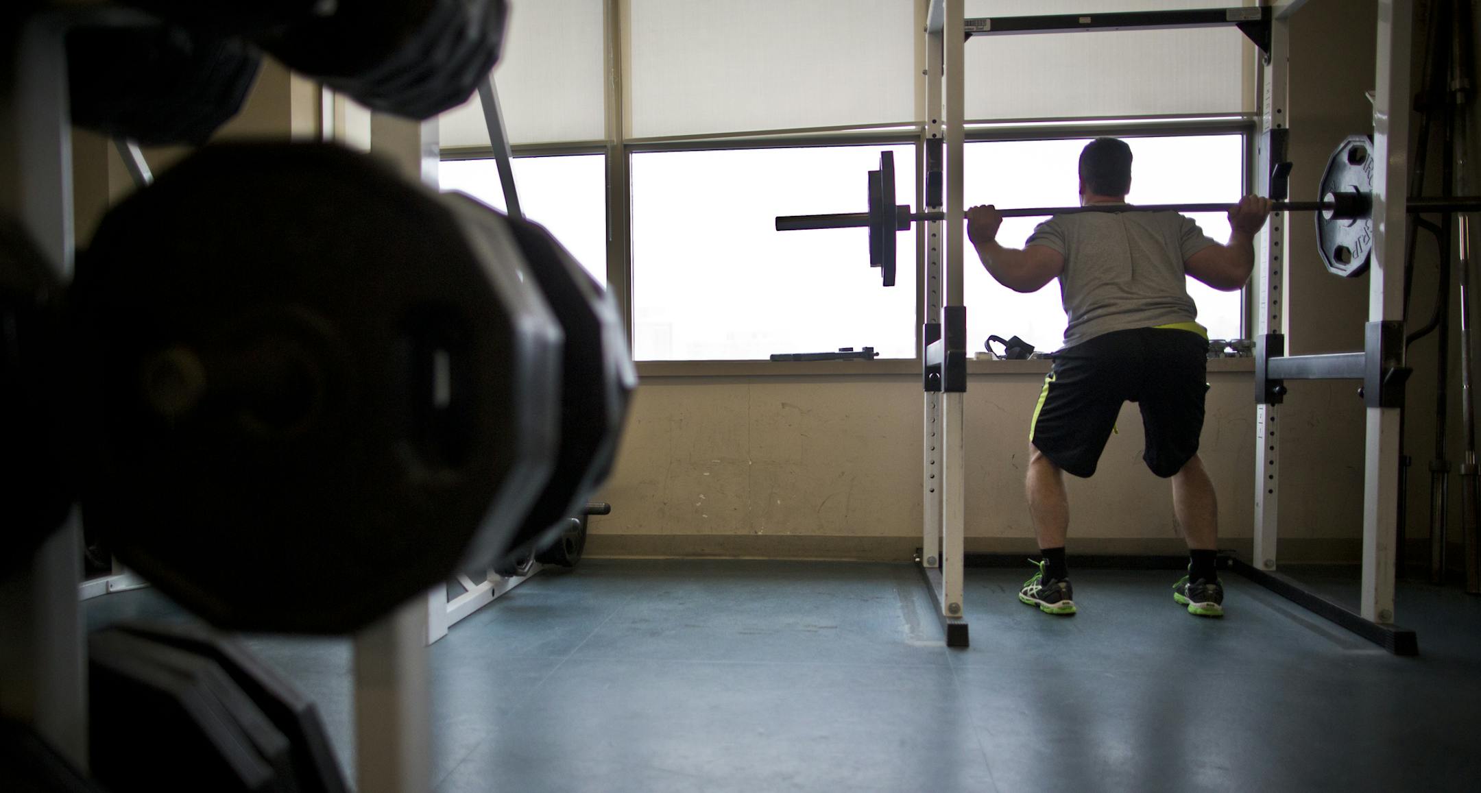St. Paul police officer Justin Miller lifted weights with a view of downtown. He takes advantage of the chance to work out during work three times a week.
