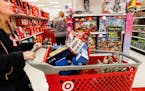 File photo: Shoppers browse the aisles during a Black Friday sale at a Target store in 2018.