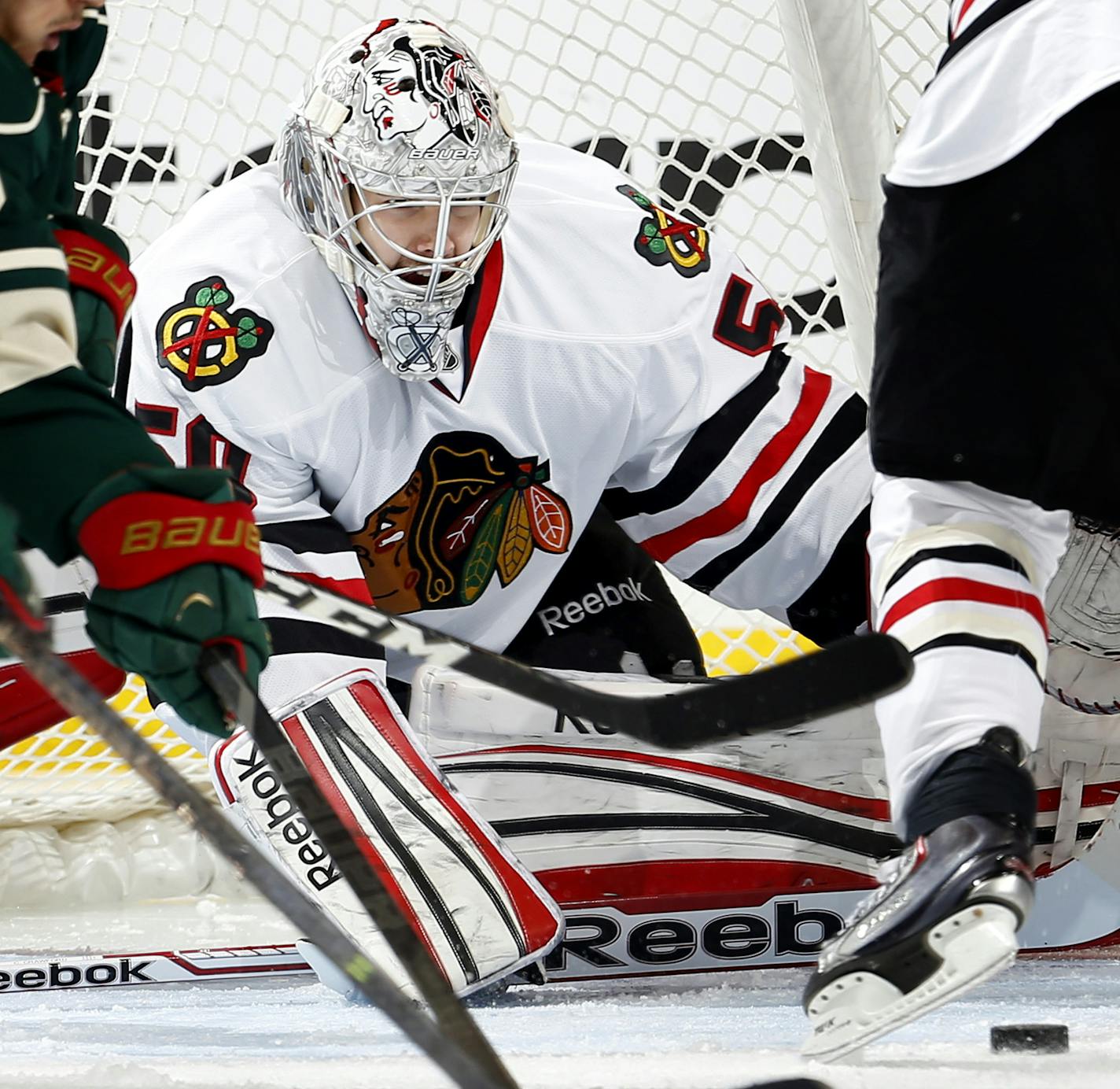 Blackhawks goalie Corey Crawford made 25 saves in the Game 4 shutout Tuesday night and got help in the form of 26 blocked shots.