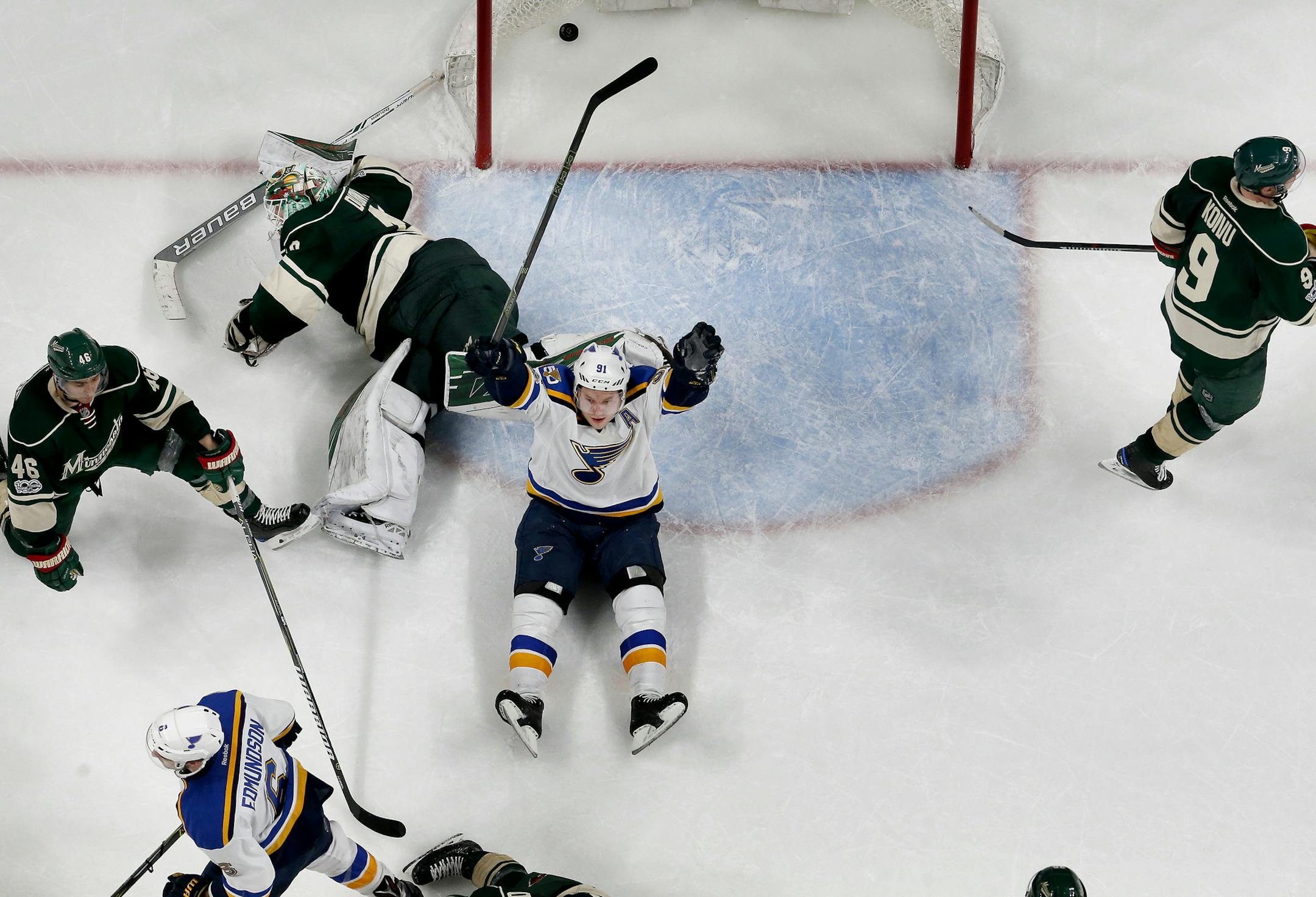 Joel Edmundson (6) and Vladimir Tarasenko (91) after Edmundson shot the puck past Minnesota Wild goalie Devan Dubnyk to win the game in overtime. ] CARLOS GONZALEZ &#xef; cgonzalez@startribune.com - April 12, 2017, St. Paul, MN, Xcel Energy Center, NHL, Stanley Cup Playoffs, Game 1, Minnesota Wild vs. St. Louis Blues