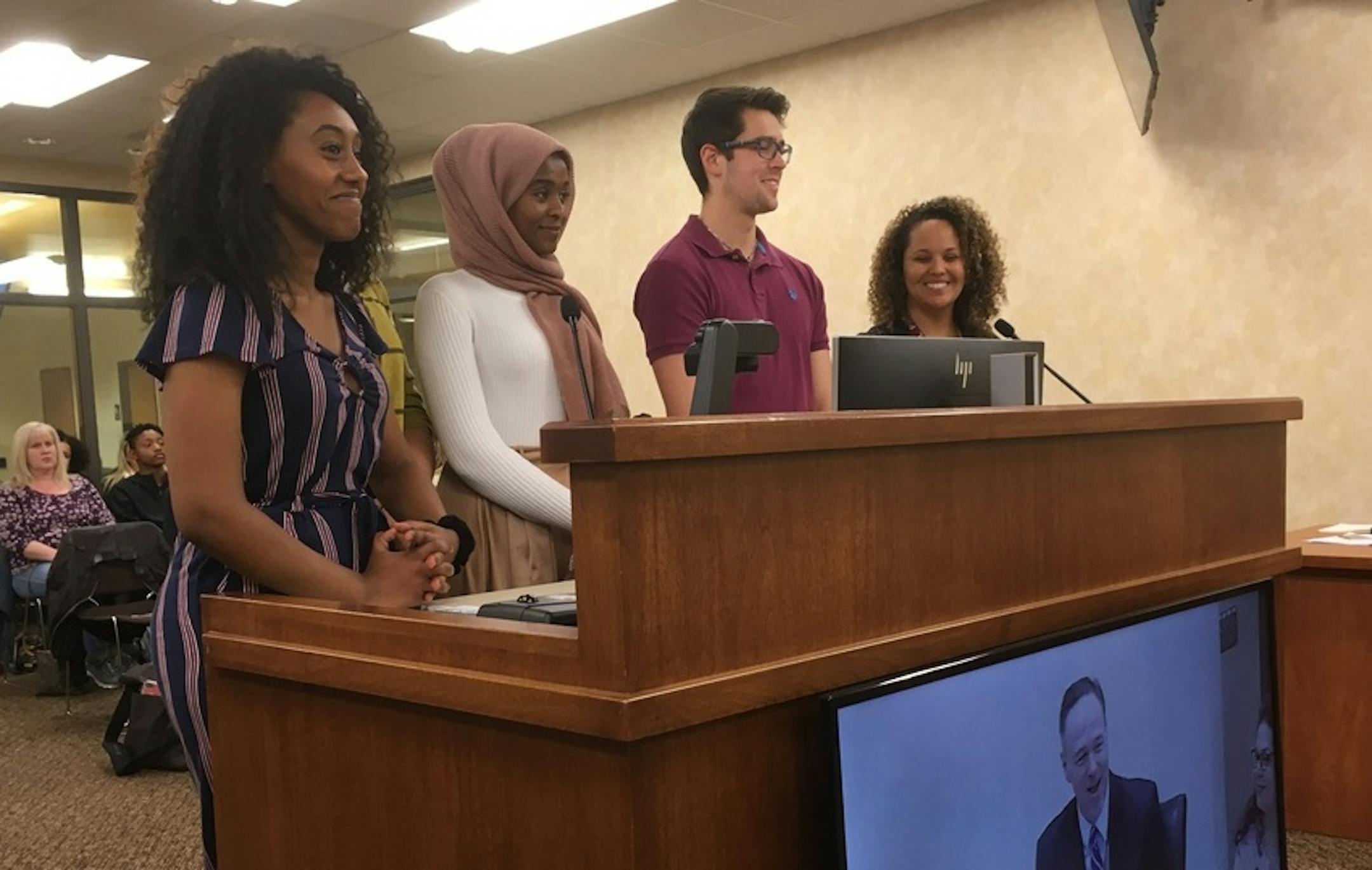 Students Naomi Gedey, Hafsa Ahmad, Emiliano Granados and teacher Jessica Davis spoke before the school board in April, seeking to wear sashes at graduation to reflect their heritage.