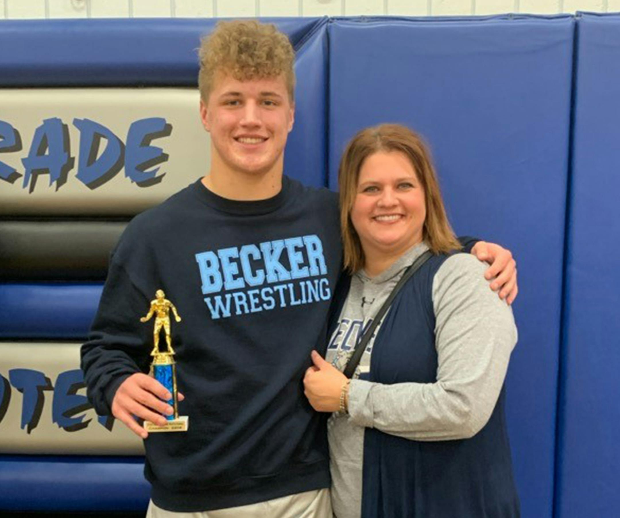 Brayden Weber of Becker High School picked up a trophy earlier this season with his mom, Sara Waytashek, in attendance.