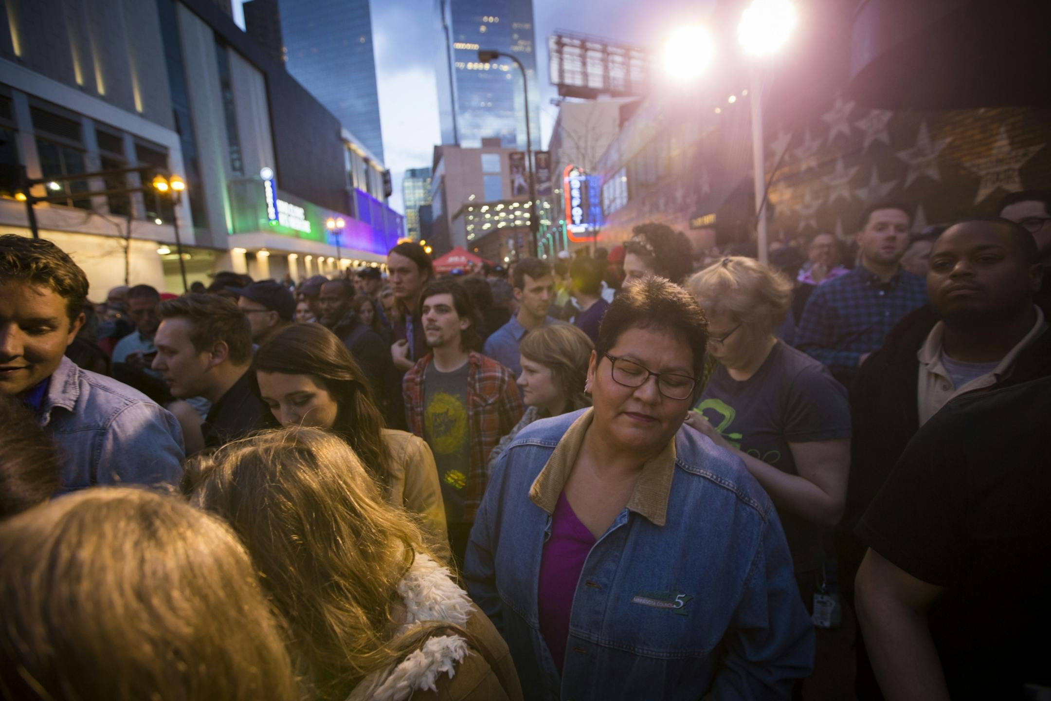 Carrie Farley closed her eyes as she danced with a huge crowd that came out for a Prince dance party outside of First Avenue on Thursday night, April 21, 2016.