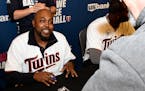 New Twins pitching coach Garvin Alston signed an autograph during TwinsFest at Target Field in January.