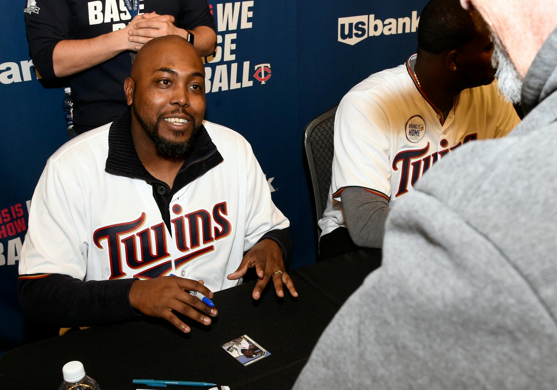 New Twins pitching coach Garvin Alston signed an autograph during TwinsFest at Target Field in January.