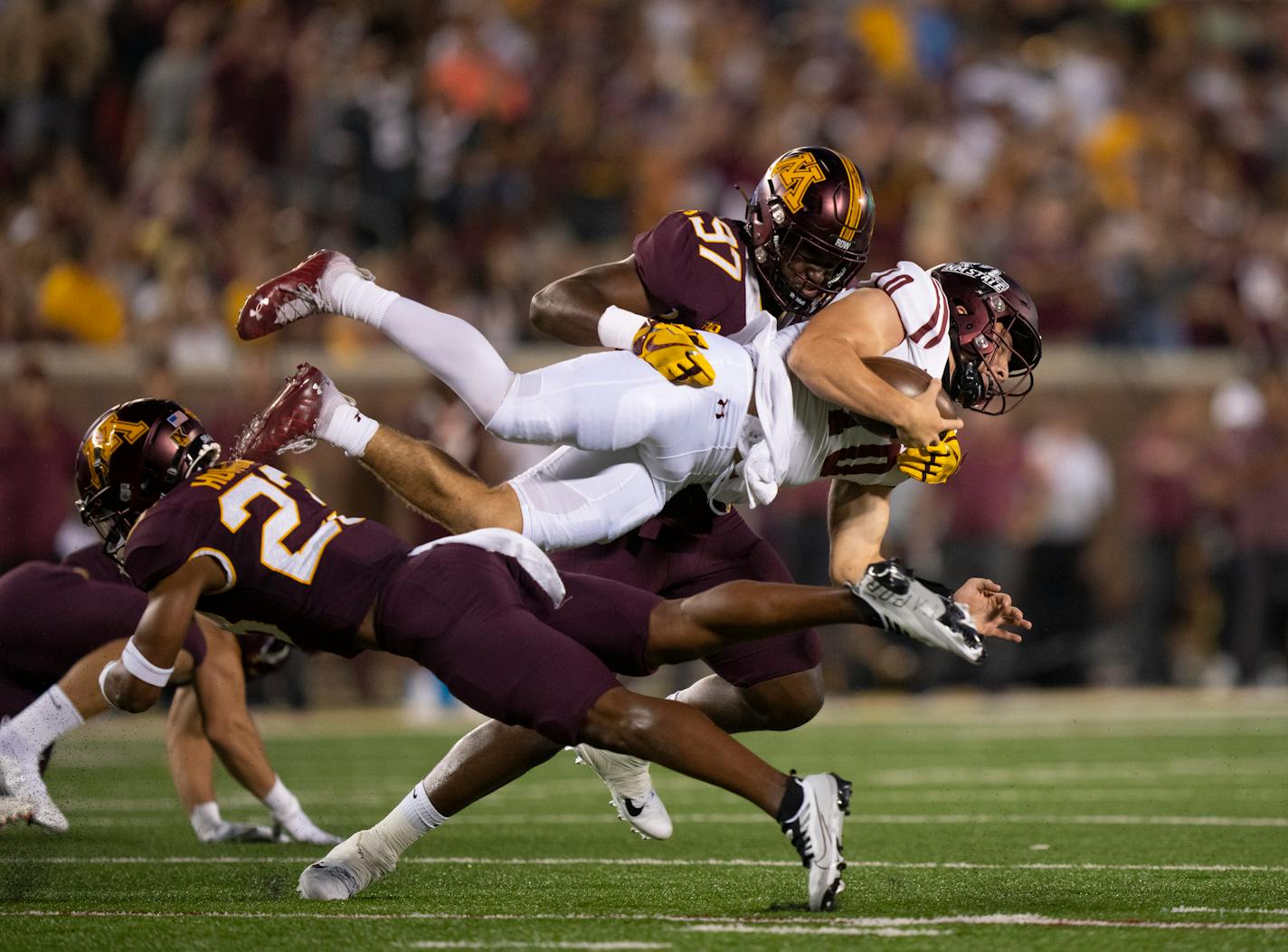 Minnesota Golden Gophers defensive lineman Jalen Logan-Redding (97) brought down New Mexico State Aggies quarterback Diego Pavia (10) in the first quarter at Huntington Bank Stadium in Minneapolis Thursday night, September 1, 2022. The University of Minnesota Gophers faced the New Mexico State Aggies in the opening football game of the season. ] JEFF WHEELER • Jeff.Wheeler@startribune.com