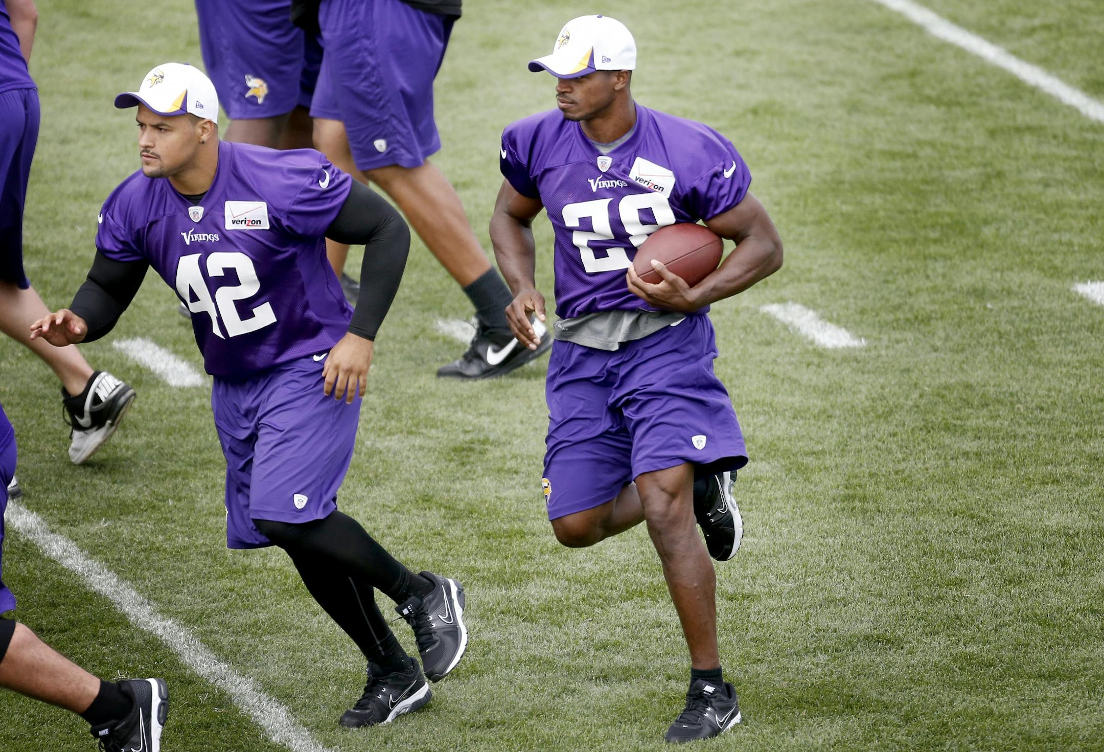 Jerome Felton (42) led the way for Adrian Peterson (28) during morning practice on Friday.