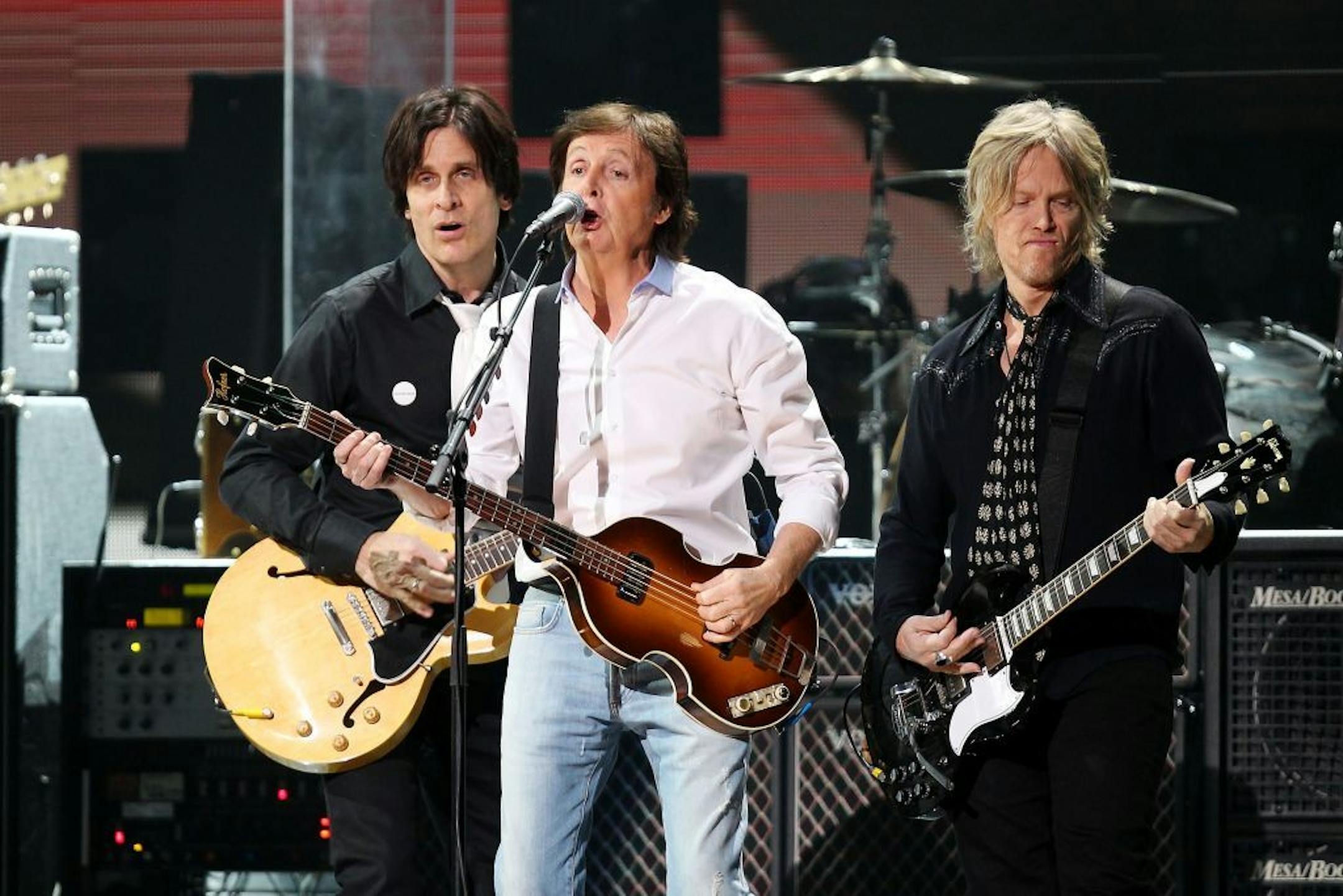 This image released by Starpix shows Paul McCartney, center, at the 12-12-12 The Concert for Sandy Relief at Madison Square Garden in New York on Wednesday, Dec. 12, 2012. Proceeds from the show will be distributed through the Robin Hood Foundation.