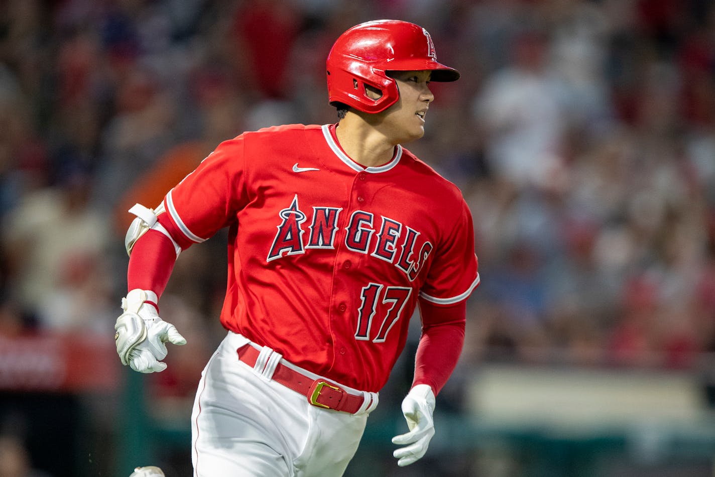 Los Angeles Angels Shohei Ohtani watches his solo home run against the Minnesota Twins during the eighth inning of a baseball game in Anaheim, Calif., Saturday, Aug. 13, 2022. (AP Photo/Alex Gallardo)