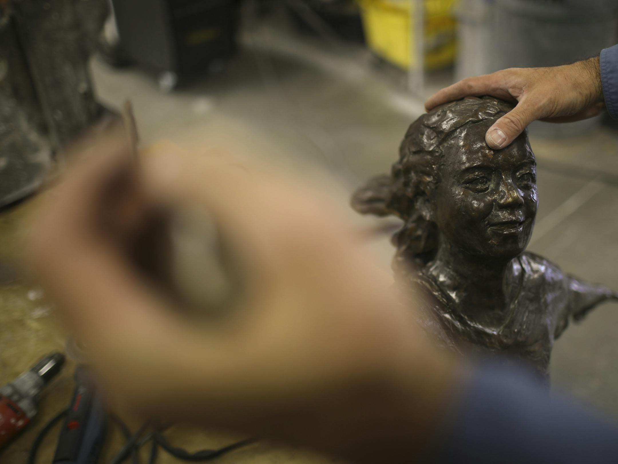 Nick Legeros examined the recovered sculpture in his studio Thursday afternoon. Other than a pretty minor scrape on its forehead, it was in remarkably good shape. ] JEFF WHEELER ï jeff.wheeler@startribune.com The bronze statue that was stolen from a park in Edina was found in a yard in neighboring Richfield. It has been returned to the artist who made it, Nick Legeros, who will prepare it in his Northeast studio for reinstallation as early as next week. Nick Legeros with his sculpture, "Dre