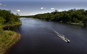 Minneapolis/May 16, 2009/10:30AM Fishermen sped along the St. Croix River near Osceola, WI. in search of a productive spot to fish. The St. Croix is a