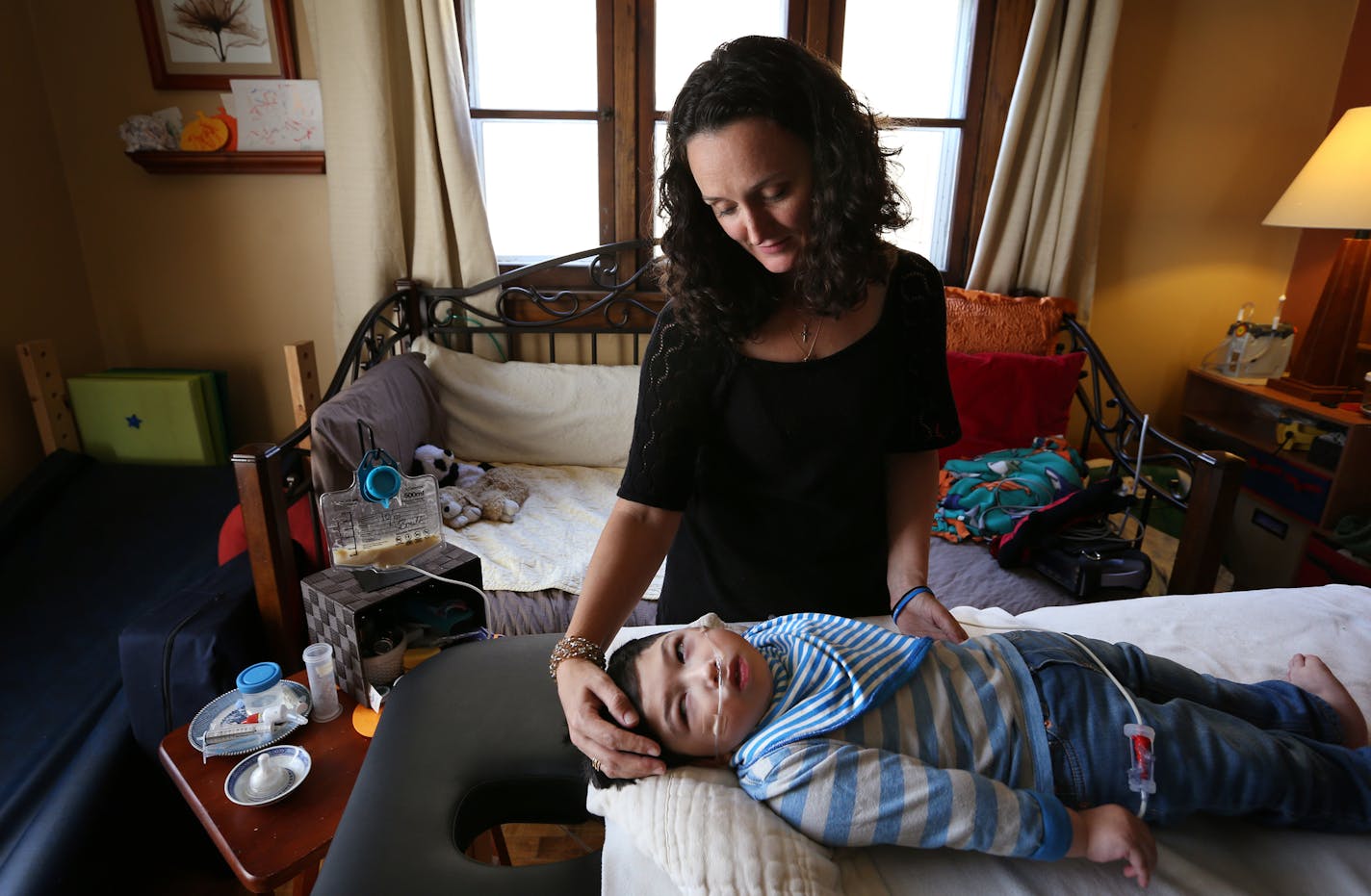 Dannell Shu tended to son Levi, 5, at home in northeast Minneapolis. &#x201c;In those precious last moments, I&#x2019;d like to stop being the lead nurse, doctor, therapist and just go back to being Mom,&#x201d; she said.