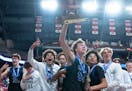 Minnetonka guard Greyson Uelmen keeps a tight grip on the Class 4A trophy, the same way the Skippers gripped their lead over Wayzata.