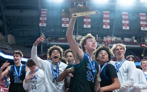 Minnetonka guard Greyson Uelmen keeps a tight grip on the Class 4A trophy, the same way the Skippers gripped their lead over Wayzata.