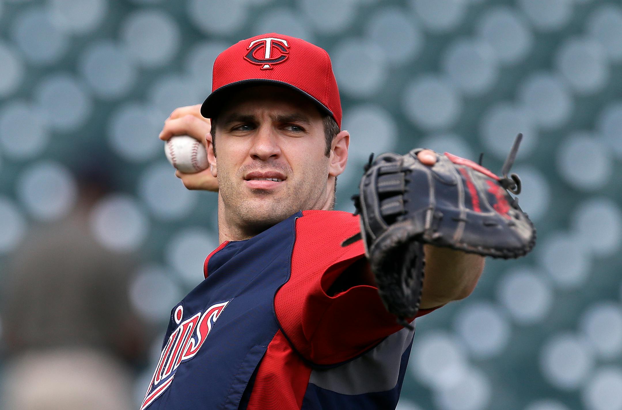 Joe Mauer should get used to wearing that first baseman's glove.