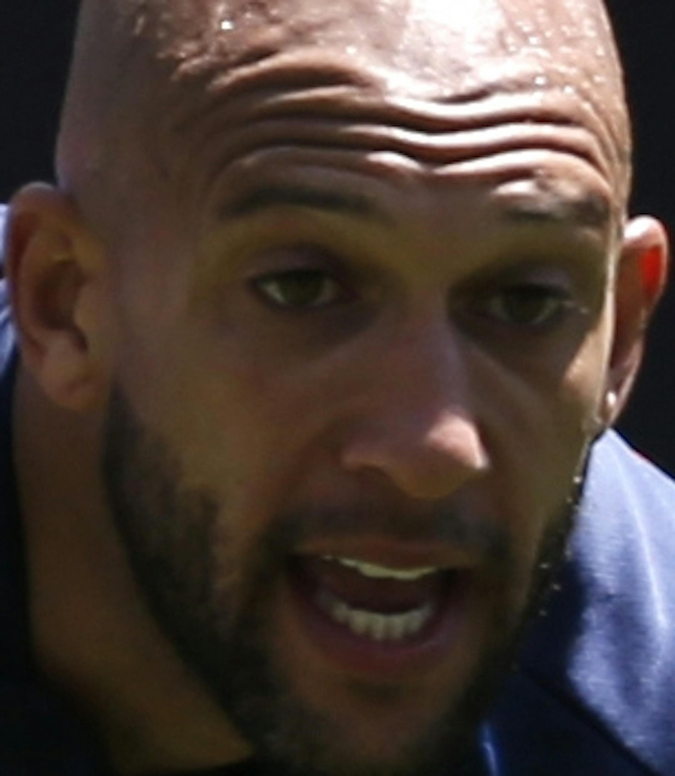 United States goalkeeper Tim Howard, left, defends against teammate Brad Davis during a scrimmage at the team's open workout, Saturday, May 31, 2014, in Harrison, N.J. The United States are scheduled to Turkey in an international friendly soccer game on Sunday. (AP Photo/Julio Cortez)