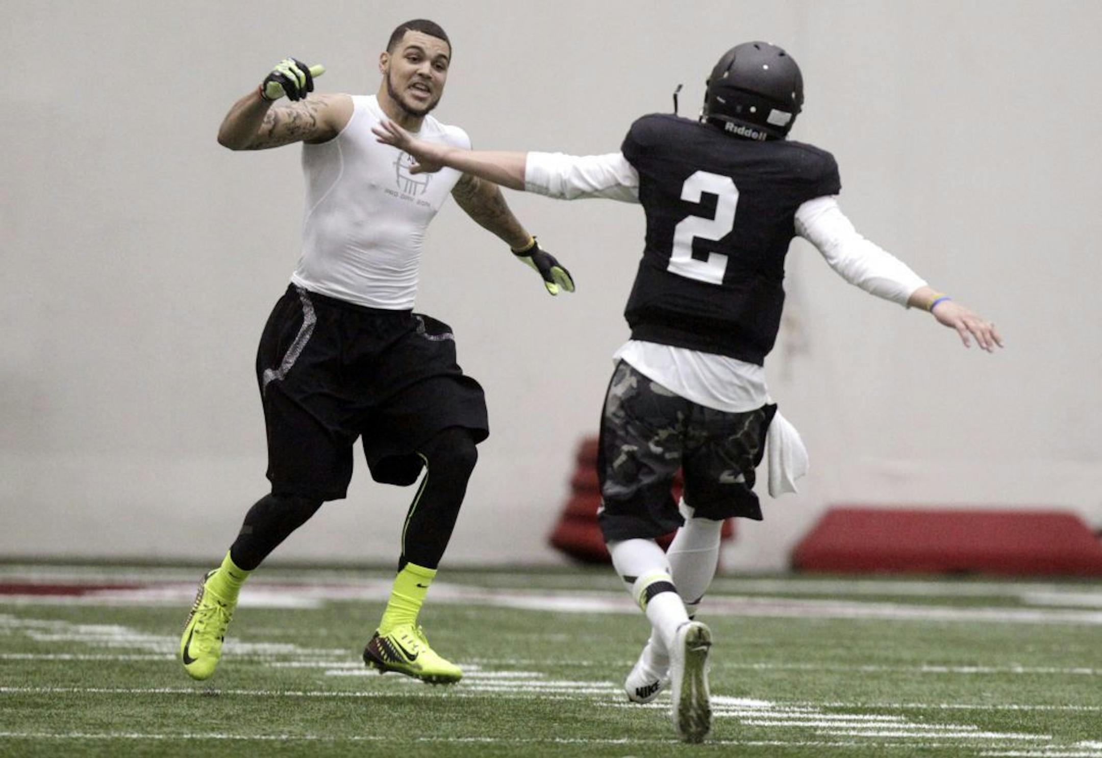 Texas A&M quarterback Johnny Manziel (2) and wide receiver Mike Evans celebrate after a pass reception during a drill at pro day for NFL football representatives�in College Station, Texas, Thursday, March 27, 2014.