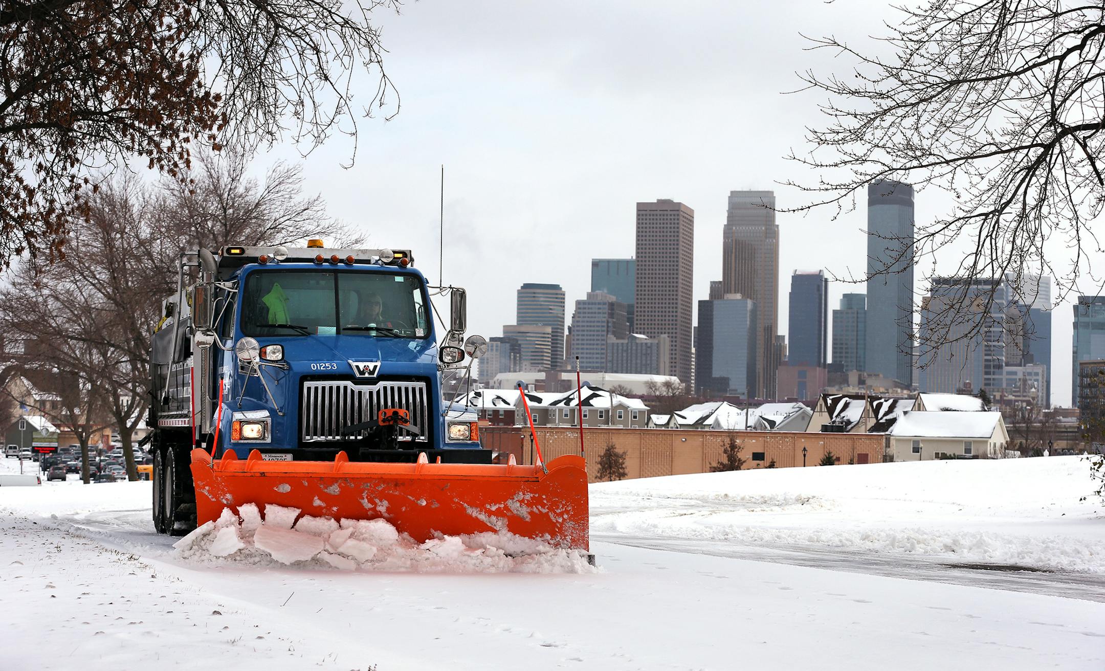 City of Minneapolis truck driver Vicky Stich plows snow and lays down sand and salt on Olson Highway Service Road in Minneapolis on Tuesday, November 11, 2014. Stich has been driving a truck for the city for 38 years. ] LEILA NAVIDI leila.navidi@startribune.com /