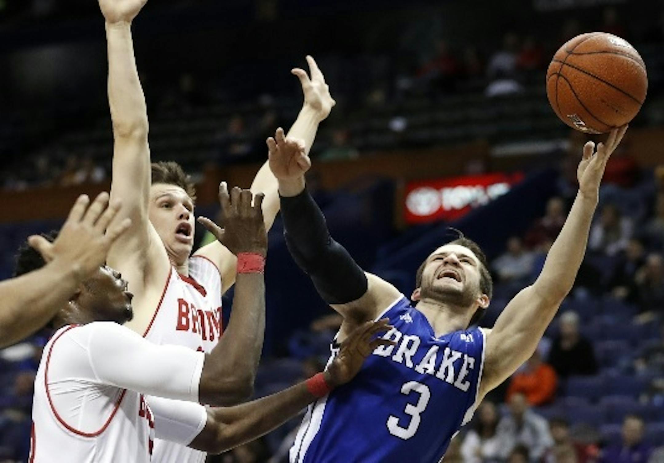 Drake senior guard Graham Woodward (3) and Gophers senior center Reggie Lynch are former Edina teammates. They meet again Monday night.