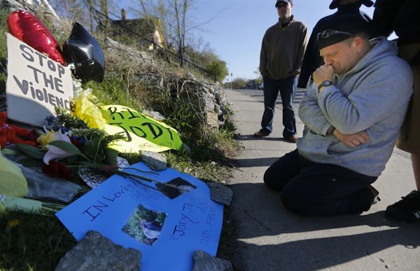 Jody Patzner Sr. grieved at the memorial erected near where his son, Jody Patzner Jr., was shot.