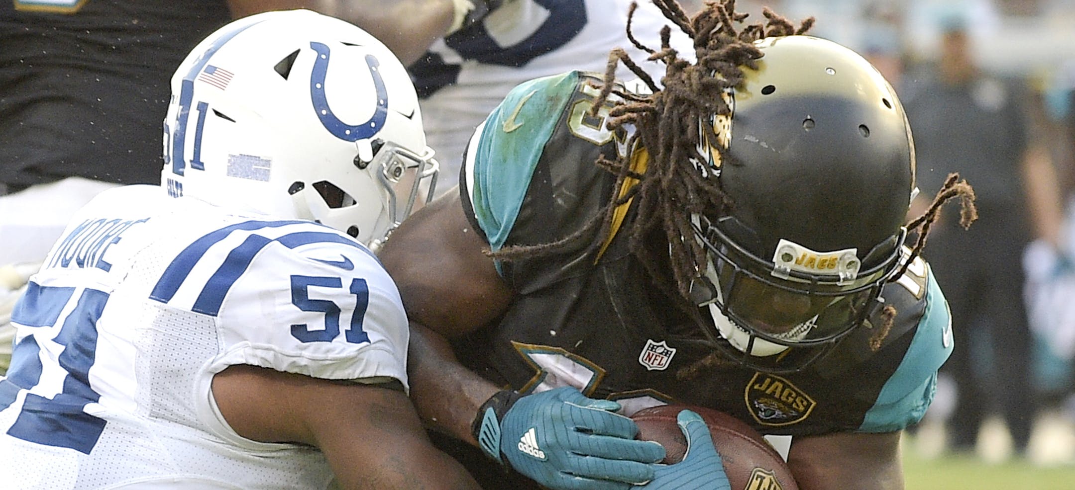 Indianapolis Colts linebacker Sio Moore (51) tries but can't stop Jacksonville Jaguars running back Denard Robinson as he scores a touchdown during the second half of an NFL football game in Jacksonville, Fla., Sunday, Dec. 13, 2015. Jacksonville won 51-16. AP Photo/Phelan M. Ebenhack)
