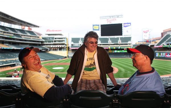 Mike 'Sammy' Samuelson (right), with Julian Loscalzo and Tom Bartsch at Target Field in 2010. Samuelson died Monday.