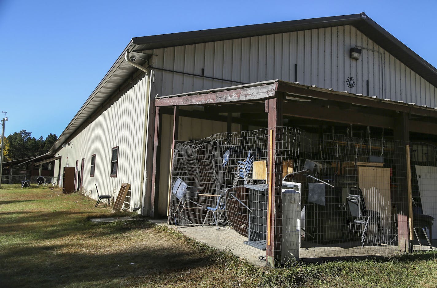 Bug-O-Nay-Ge-Shig High School was once a pole shed for vehicle maintenance and turned into a high school and is lacking much, including storage space. These chairs and desks were seen in an exterior storage space Tuesday, Oct. 21, 2014, in Bena, MN.](DAVID JOLES/STARTRIBUNE)djoles@startribune The Bug O Nay Ge Shig School is a culturally based alternative school that opened in 1975 with a mission of serving Ojibwe children and has matured into a fully accredited educational program. Bug School is