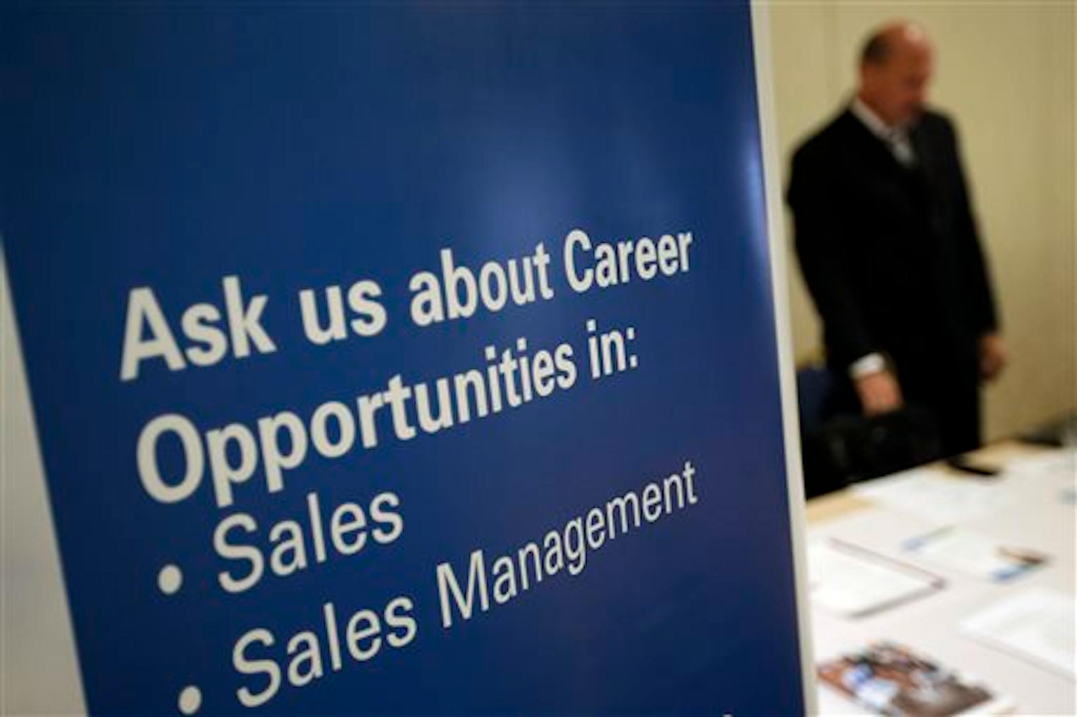 FILE - In this Monday, June 24, 2013, file photo, a recruiter waits to meet with job seekers at a career fair, in King of Prussia, Pa. The Labor Department reports on the number of people who applied for U.S. unemployment benefits last week. The report will be released at 8:30 a.m. Eastern time Thursday April 10, 2014. (AP Photo/Matt Slocum, File)
