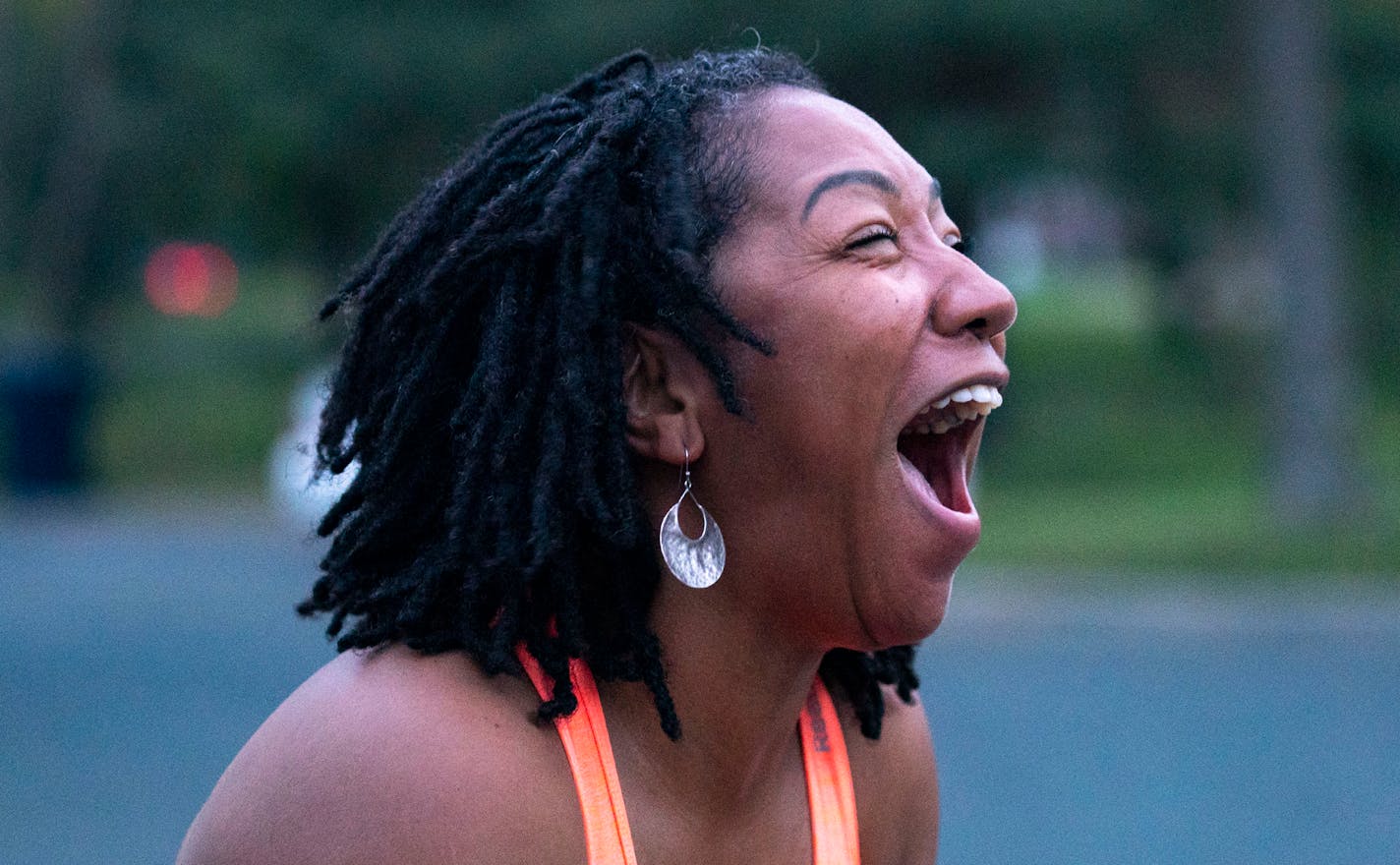 De'Vonna Pittman laughed as she finished her esepcially long turn during double dutch practice at Central Park in Brooklyn Park on Thursday, September 30, 2021. ]