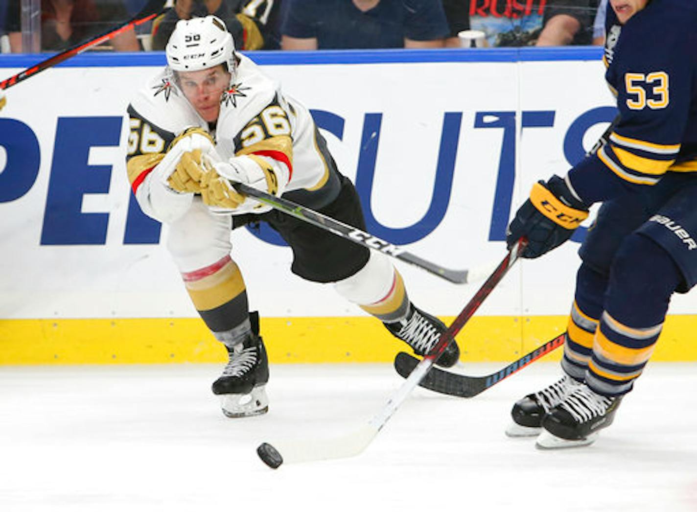 Vegas Golden Knights forward Erik Haula (56) reaches for the puck during the third period of an NHL hockey game against the Buffalo Sabres, Monday, Oct. 8, 2018, in Buffalo N.Y. (AP Photo/Jeffrey T. Barnes)