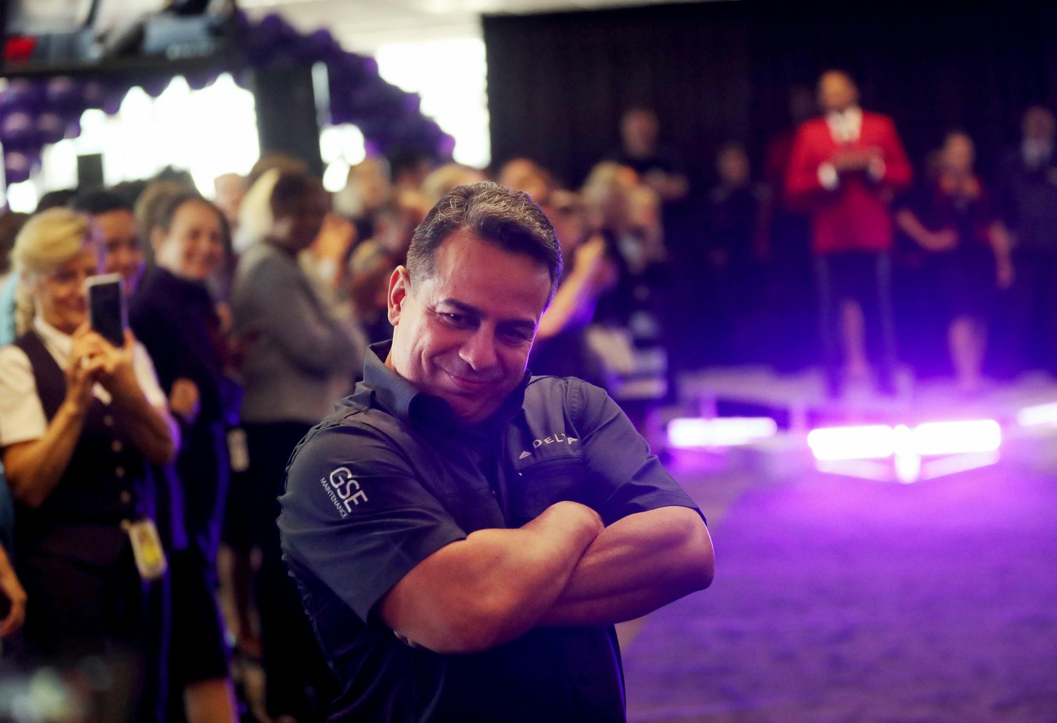 Delta Air Lines launched its new line of uniforms for all its employees during a fashion show at MSP with designer Zac Posen & manufacturer Lands End showcasing the new look Tuesday, May, 29, 2018, at Terminal 1 between Gates G1-G3 at the Minneapolis-St. Paul International Airport in Bloomington, MN. Here, Igrain Pabon of Delta GSE struts his stuff.