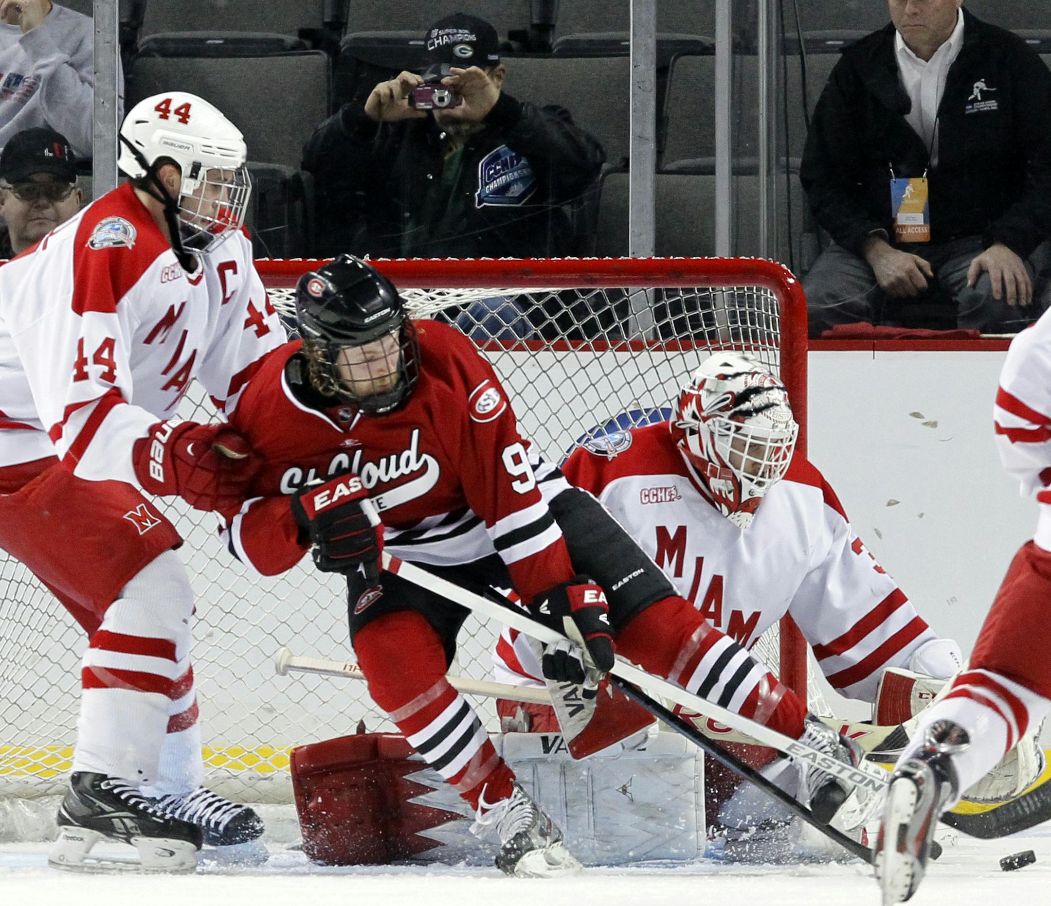 St. Cloud State freshman Joey Benik (9) tried to get off a shot on Miami (Ohio) goalie Ryan McKay during the second period.