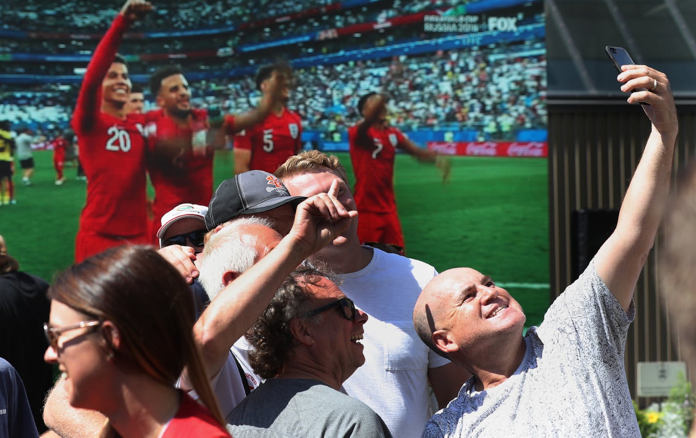 World Cup fever has spread to the U.S., evidenced when customers at Brit's Pub watched England defeat Sweden 2-0 in a quarterfinal Saturday. Leonardo Saavadre of Minneapolis, right, takes a selfie with friends up on Brit's roof after the game.