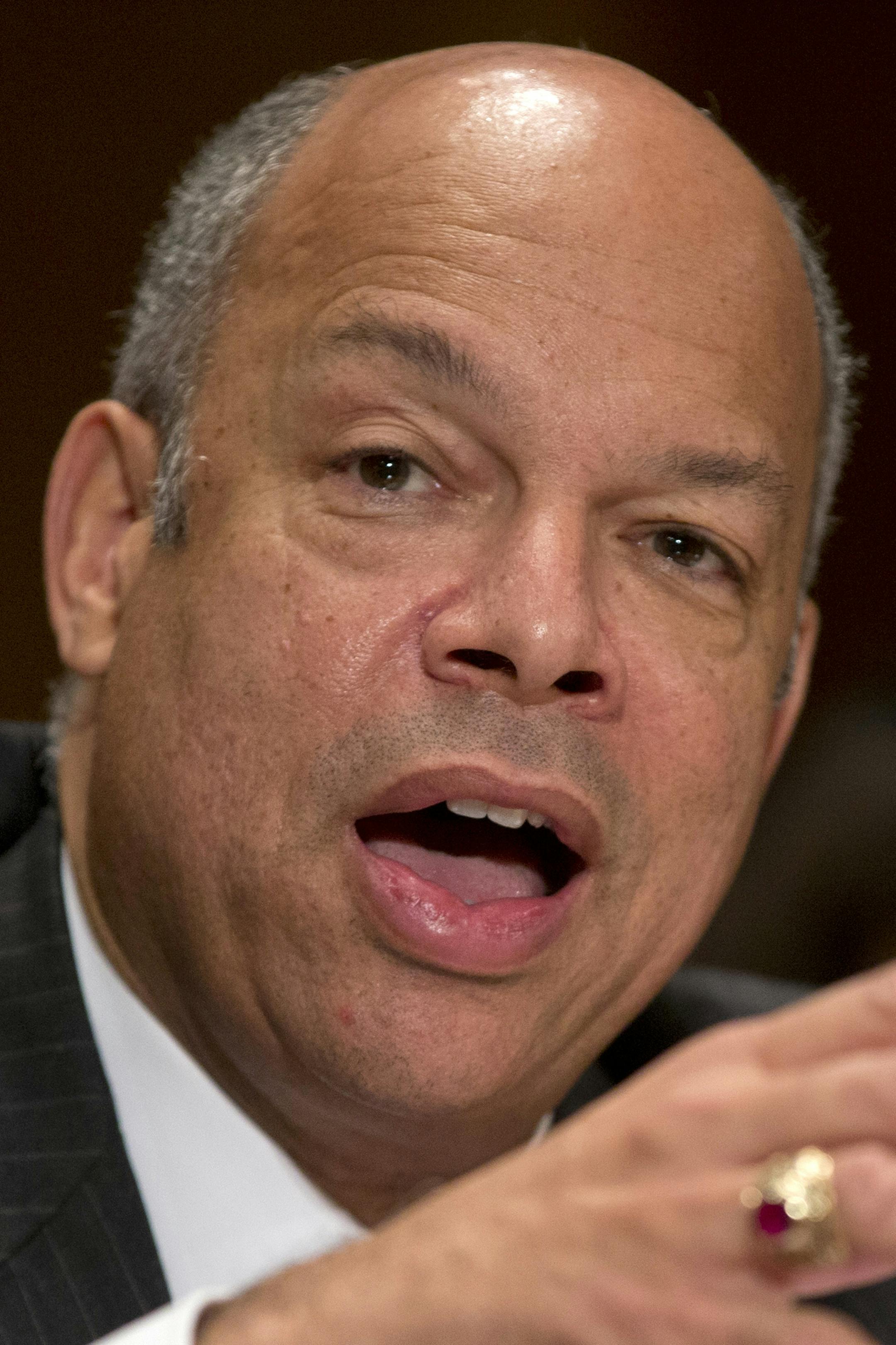 FILE - In this Nov. 13, 2013 file photo, Homeland Security Secretary nominee Jeh Johnson testifies on Capitol Hill in Washington before the Senate Homeland Security and Governmental Affairs Committee hearing on his nomination. Democrats begin a drive this week to muscle a half dozen of President Barrack Obama's Republican-opposed nominees through the Senate after clamping shackles on traditional minority party rights in last month's power play against the GOP. Republicans, however, still have so