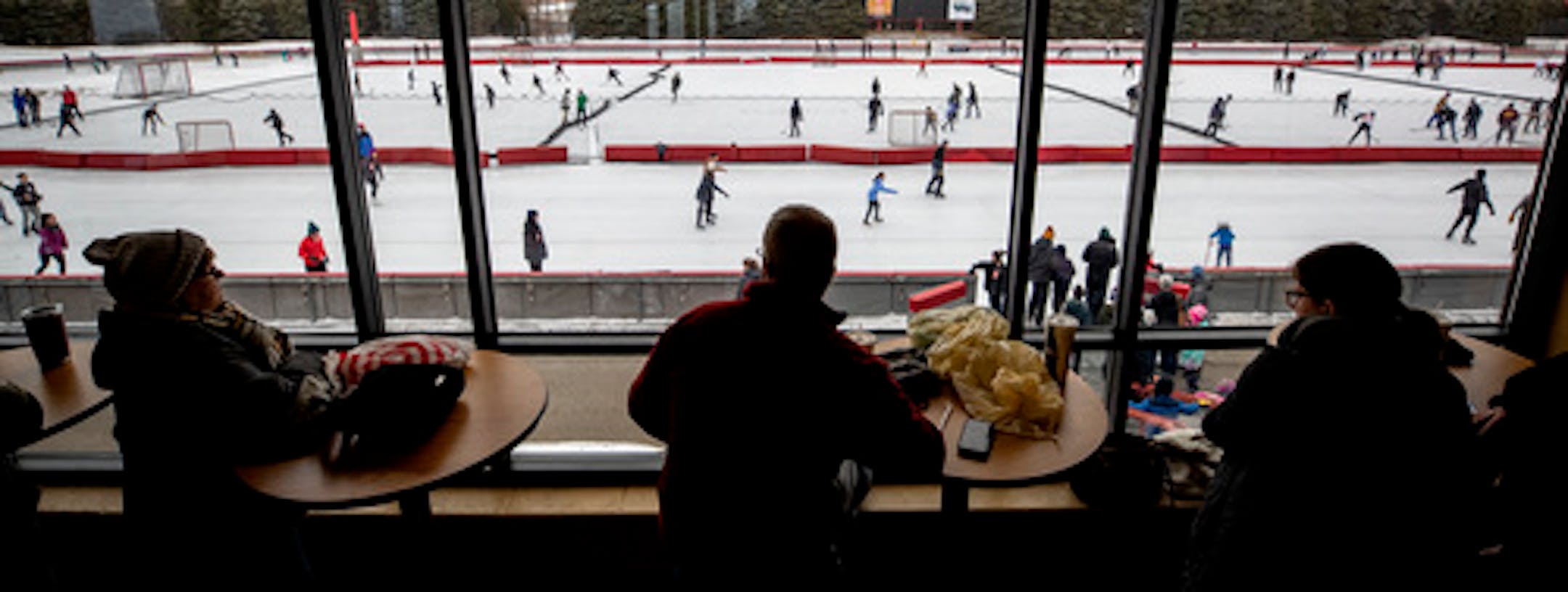 Adults watched from inside as skaters make their way around the John Rose Minnesota Oval on Wednesday afternoon.