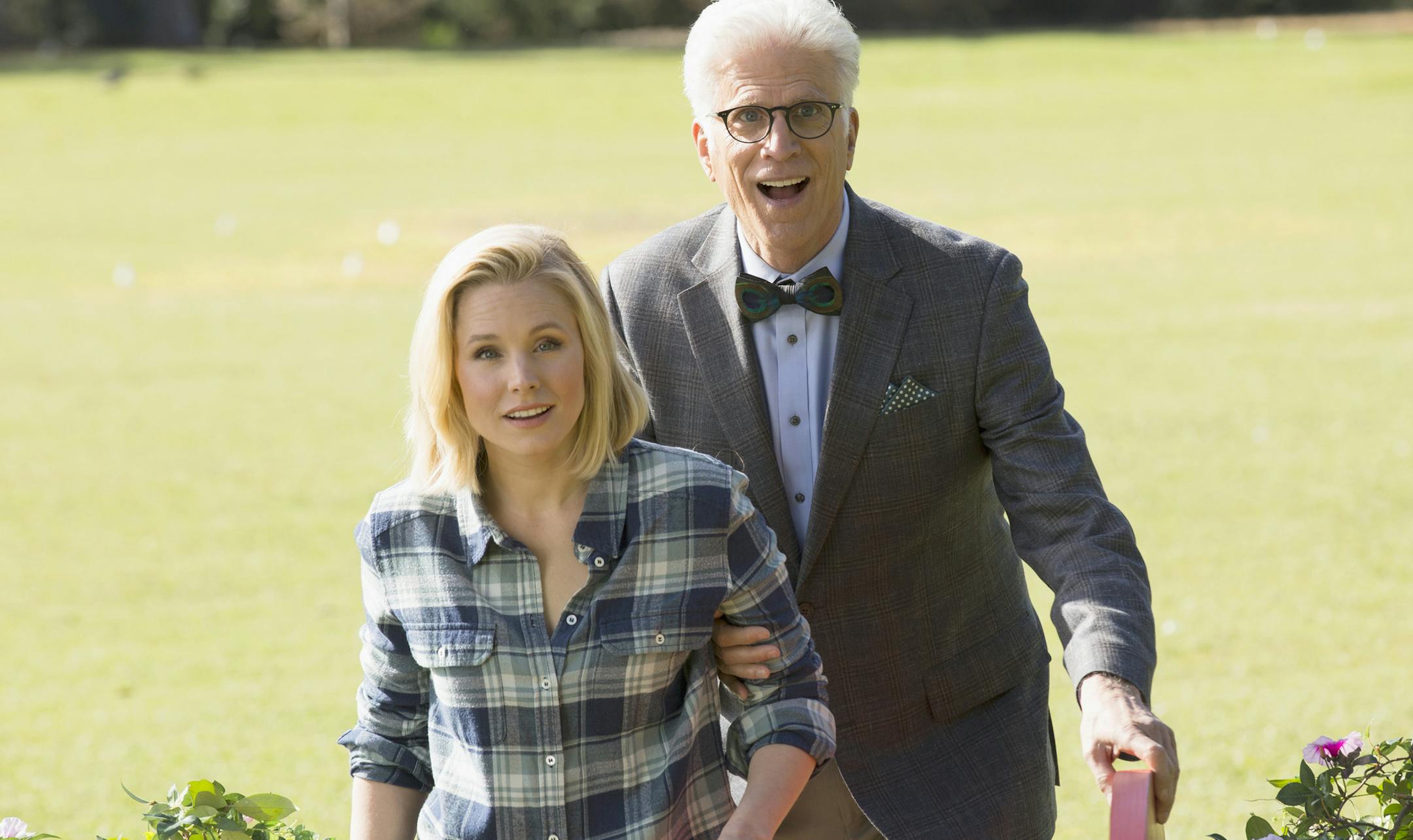 This image released by NBC shows Kristen Bell as Eleanor, left, and Ted Danson as Michael in a scene from, "The Good Place," premiering on Sept. 19. (Justin Lubin/NBC via AP)