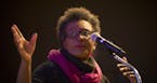 Poet Claudia Rankine references an image being projected behind her during the beginning of her poetry reading on Friday night at the Loft Literary Ce