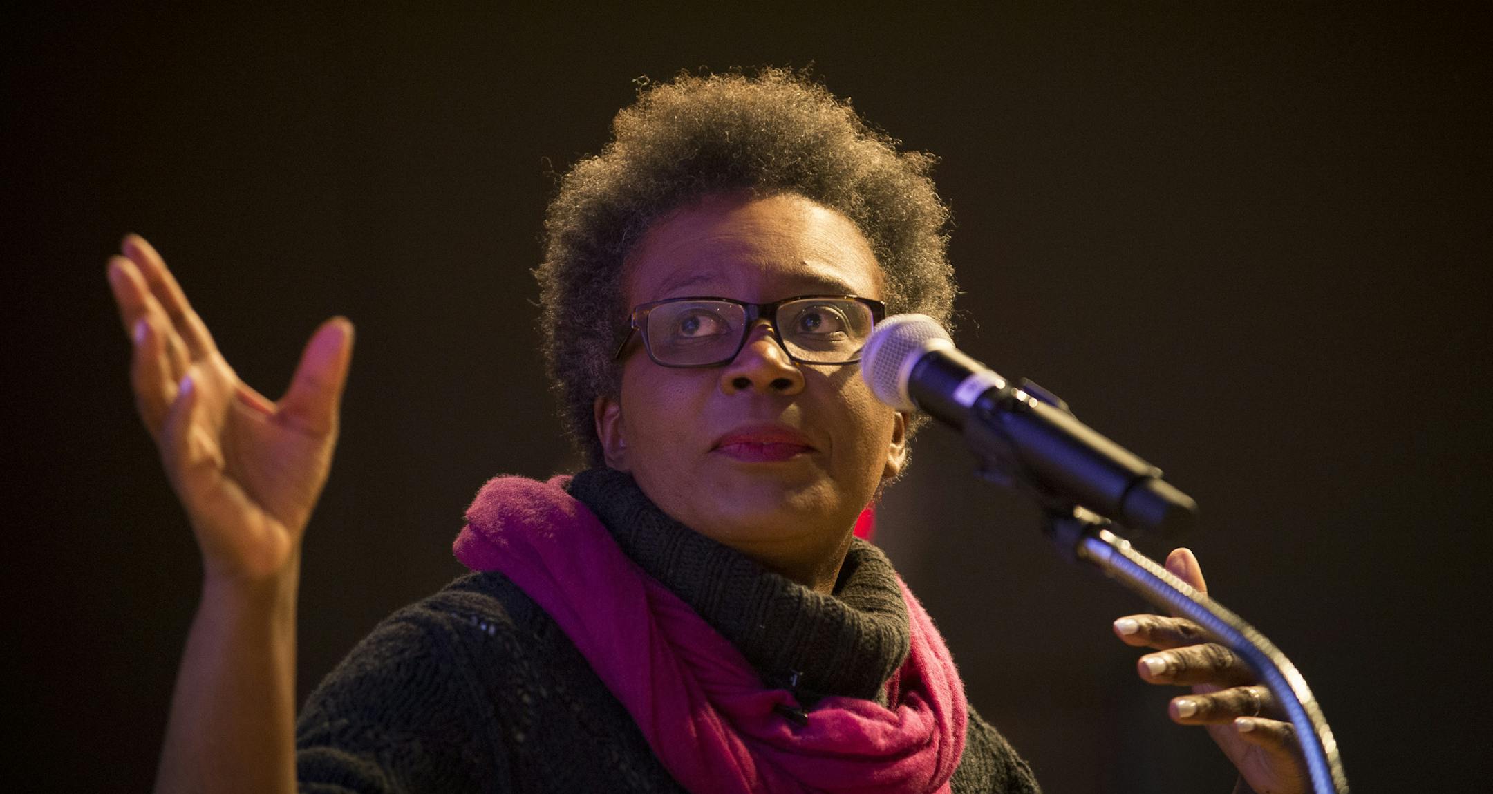 Poet Claudia Rankine references an image being projected behind her during the beginning of her poetry reading on Friday night at the Loft Literary Center. ] (Aaron Lavinsky | StarTribune) St. Paul author Marlon James introduces poet Claudia Rankine at the Loft Literary Center on Friday, Jan. 30, 2015 in Minneapolis. She is published by Graywolf Press, and her book, "Citizen," was a finalist for the National Book Award. It is currently a finalist for the National Book Critics Circle Award in two