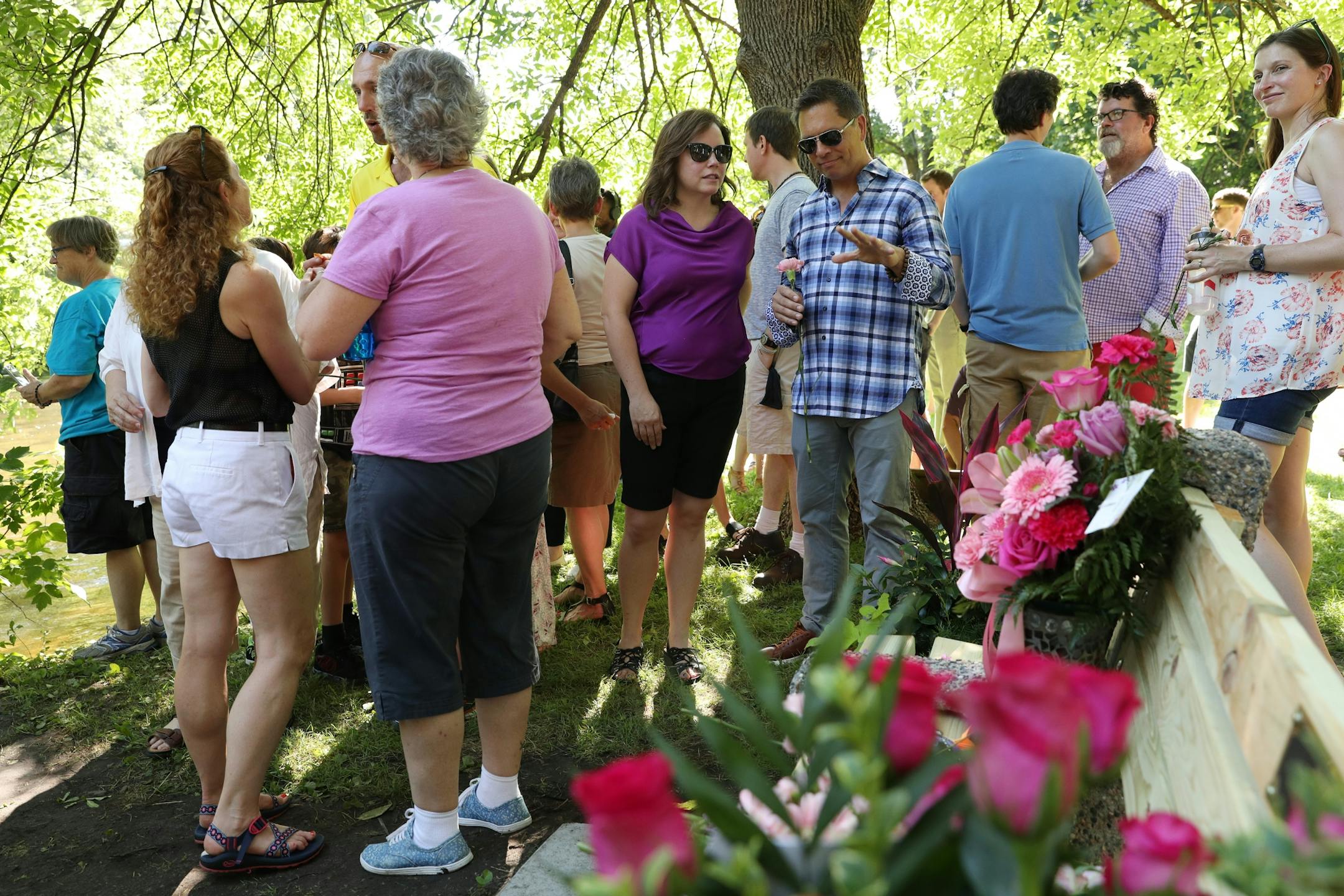 Don Damond talked with family and friends following a gathering to dedicate a bench to Justine Ruszczyk Damond at Minnehaha Creek between 53rd and 54th streets on the one year anniversary of her death.