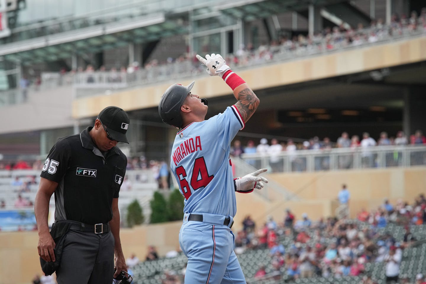 Minnesota Twins first baseman Jose Miranda (64) points to the sky after hitting a home run in the bottom of the first inning which also drove in Minnesota Twins second baseman Luis Arraez (2) Wednesday, Aug. 17, 2022, Minneapolis, Minn. Kansas City Royals at Twins ] GLEN STUBBE • glen.stubbe@startribune.com