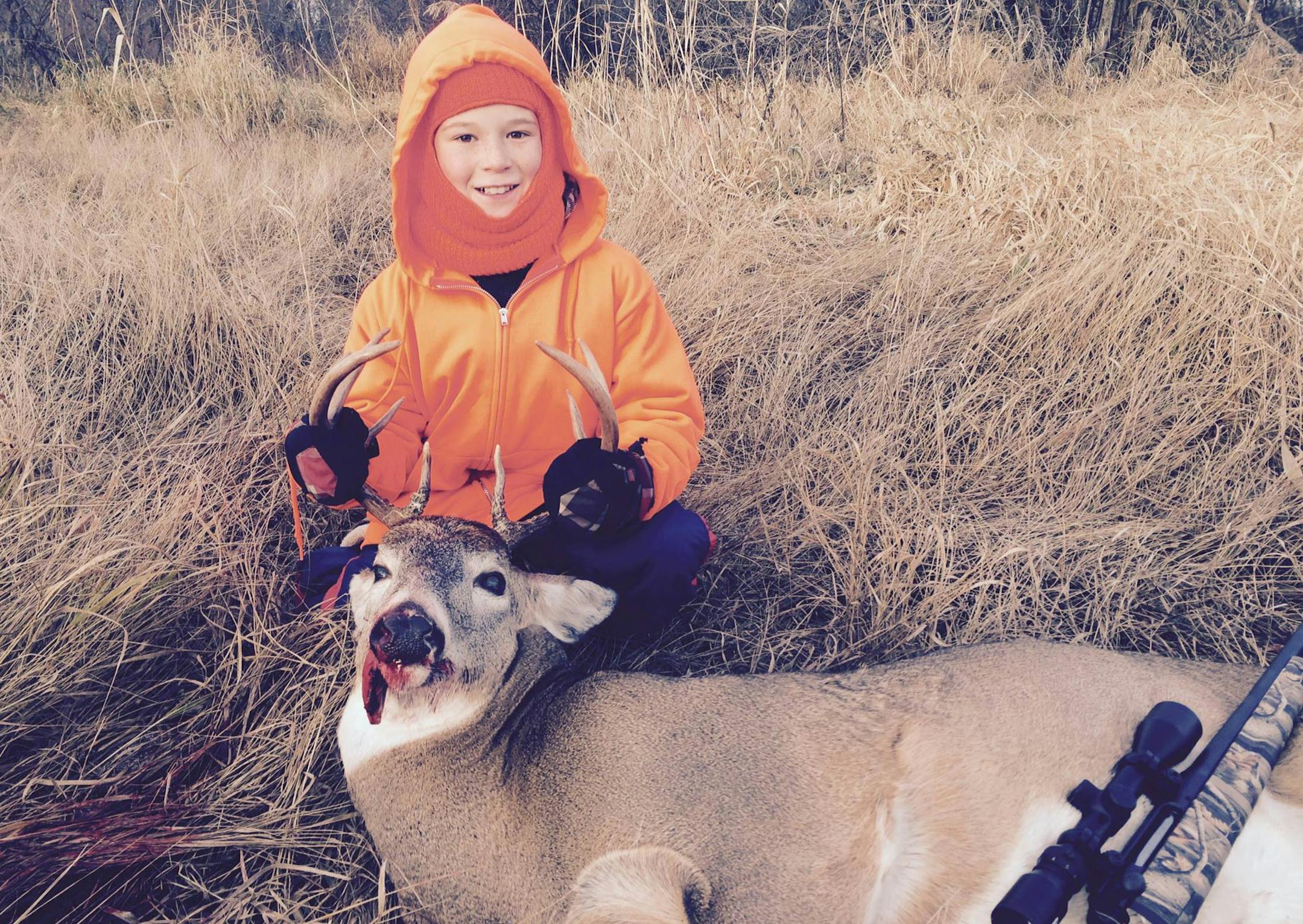 Rocco Karlsen, 11, of Minneapolis, with his first-ever whitetail.