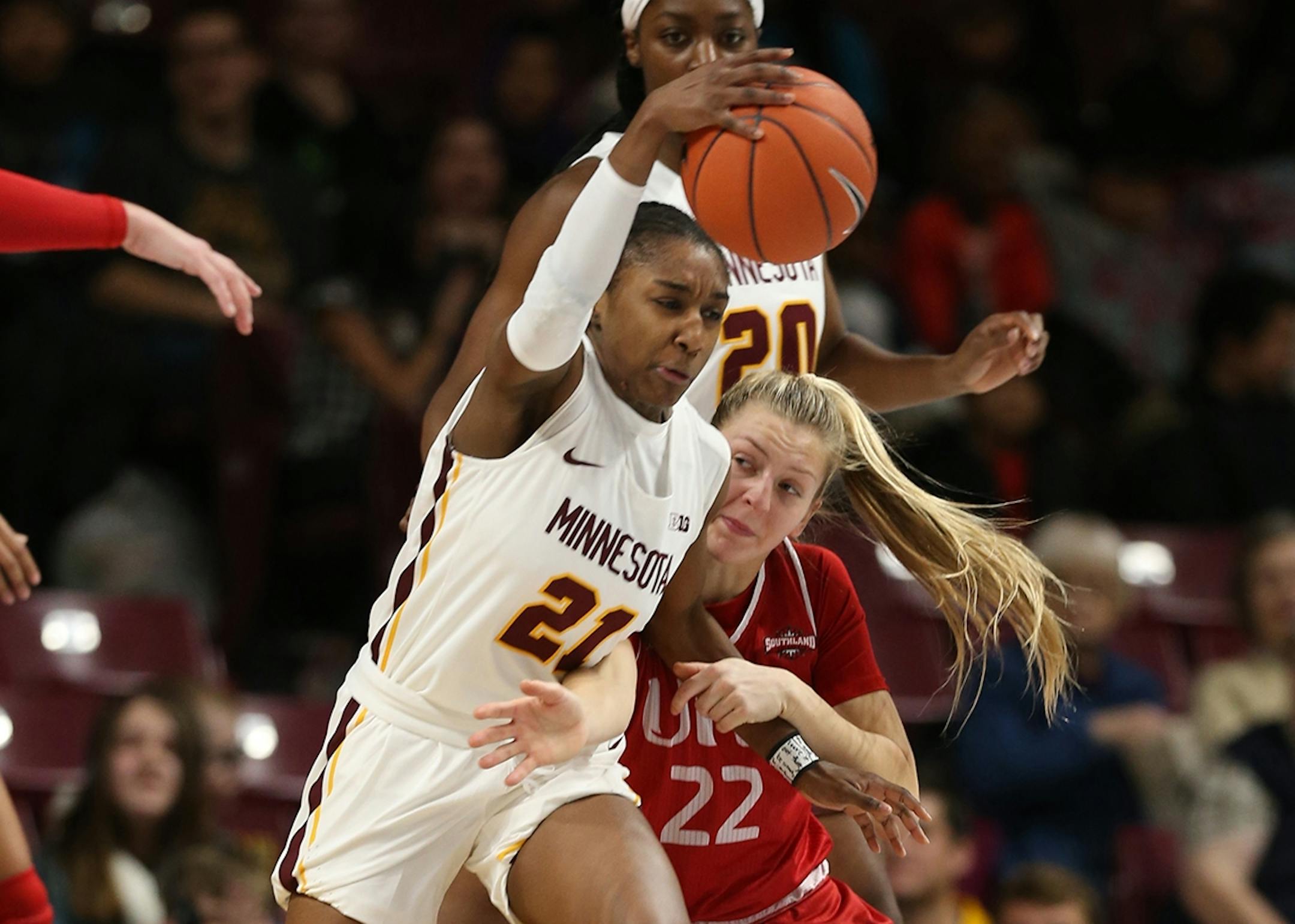 Jasmine Brunson(21) and Liz Holter(22) battle for the ball.