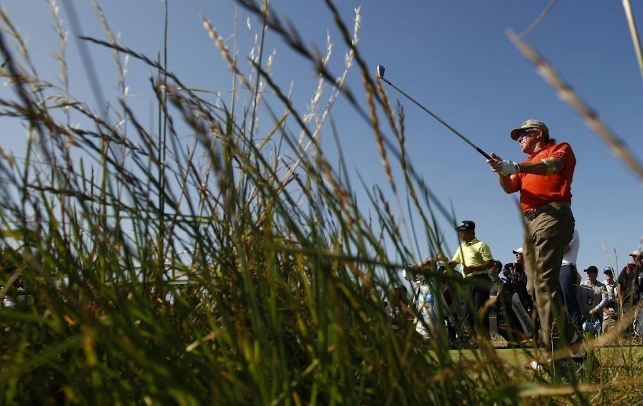 Miguel Angel Jimenez of Spain plays a shot off the 15th tee during the second round of the British Open Golf Championship at Muirfield, Scotland, Friday July 19, 2013.