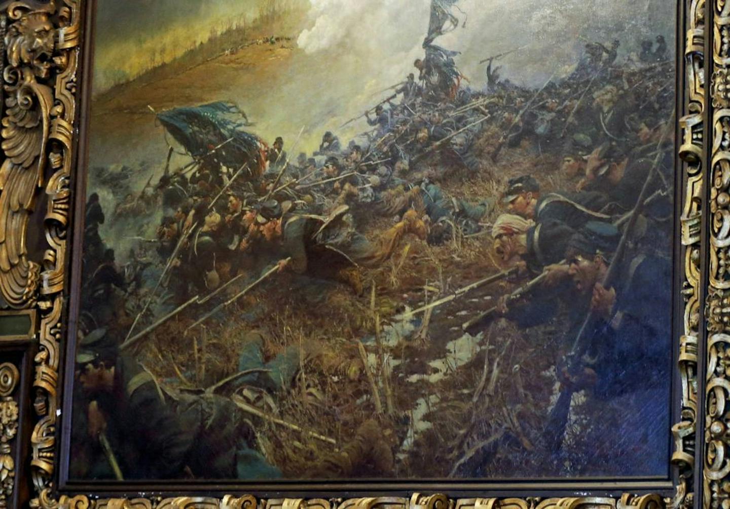 FILE - In this March 6, 2014 file photo, Howard Pyle's 1906 painting, "The Battle of Nashville," depicting the Civil War battle, hangs in the governor's reception room at the Minnesota State Capitol in St. Paul, Minn. A commission overseeing restoration of the Capitol is torn over whether to bring back "The Battle of Nashville" and other Civil War paintings that were previously displayed there.