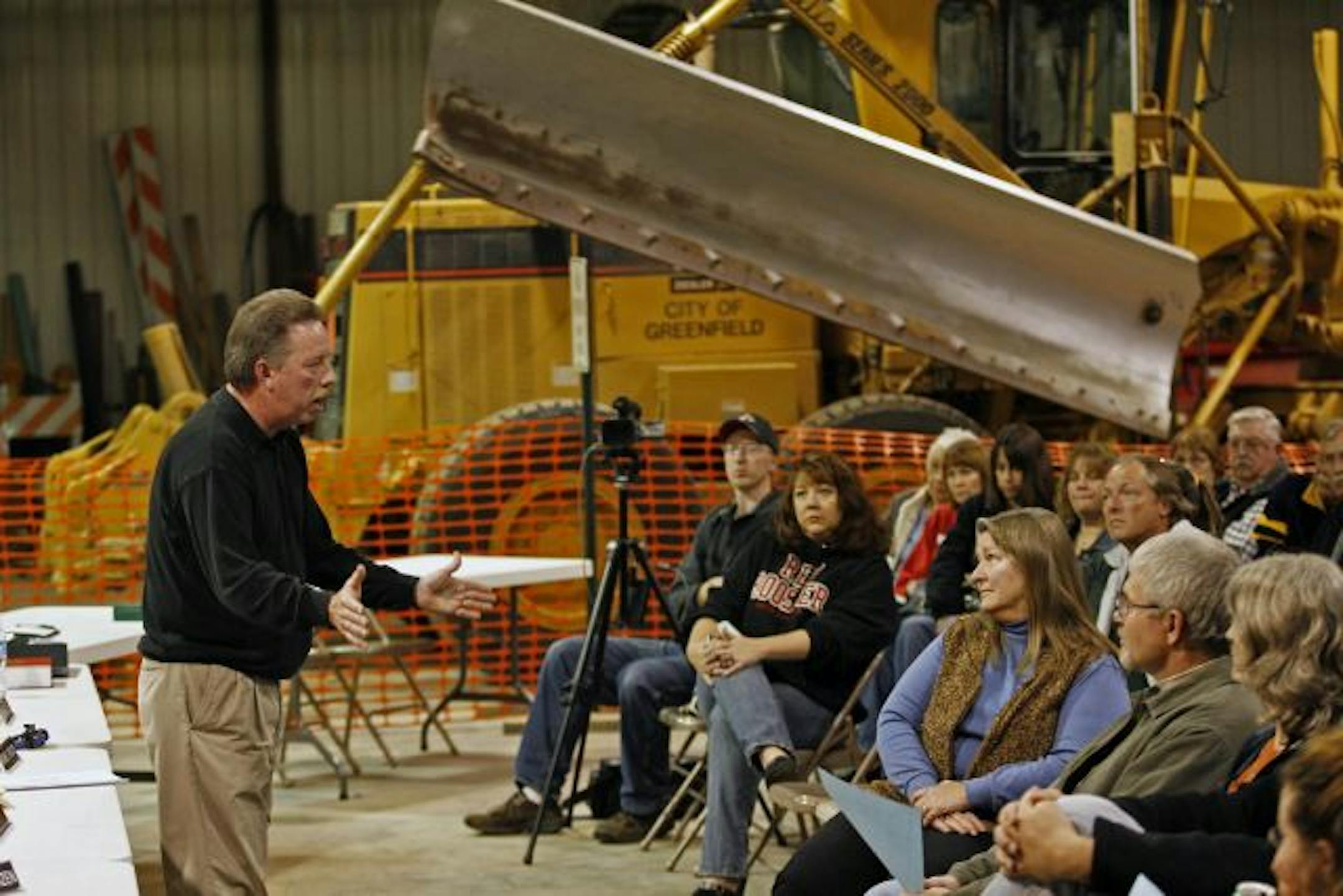 Council Member Michael Erickson, left, and residents came to discuss Greenfield's insurance problem Tuesday, but the three-member council majority and the mayor failed to show . Another meeting is scheduled for 5 p.m. today to consider the matter.